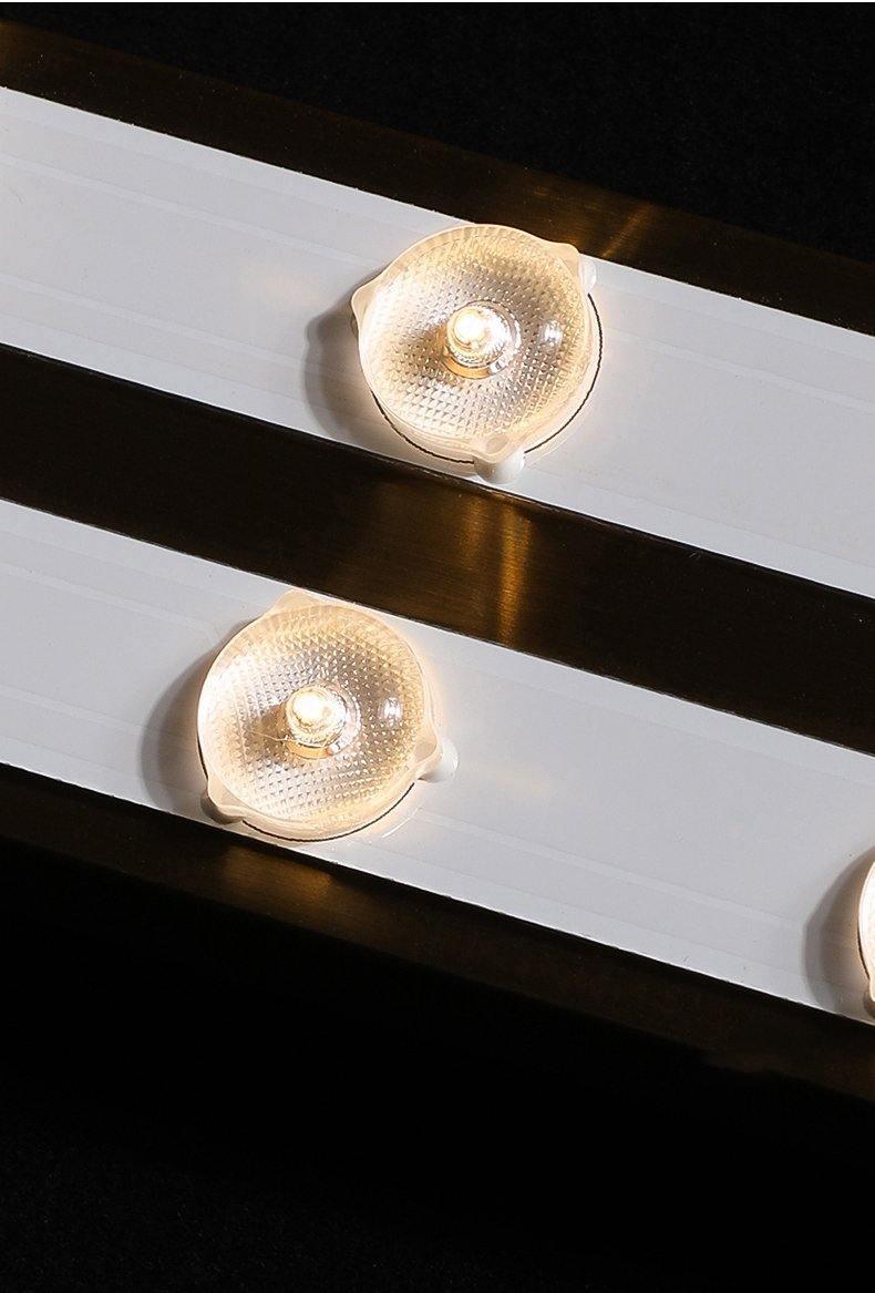 Round reflector elements on internal light strips between metal rails