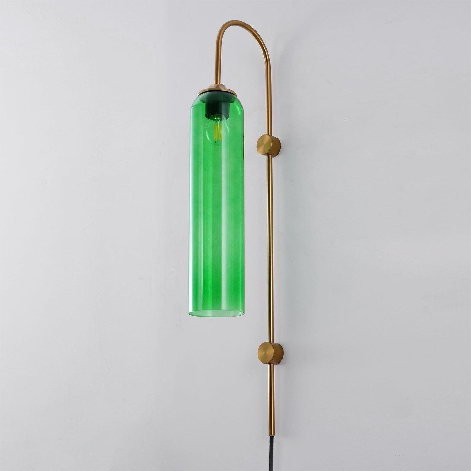 Green cylindrical shade beneath a curved gold-coloured wall arm