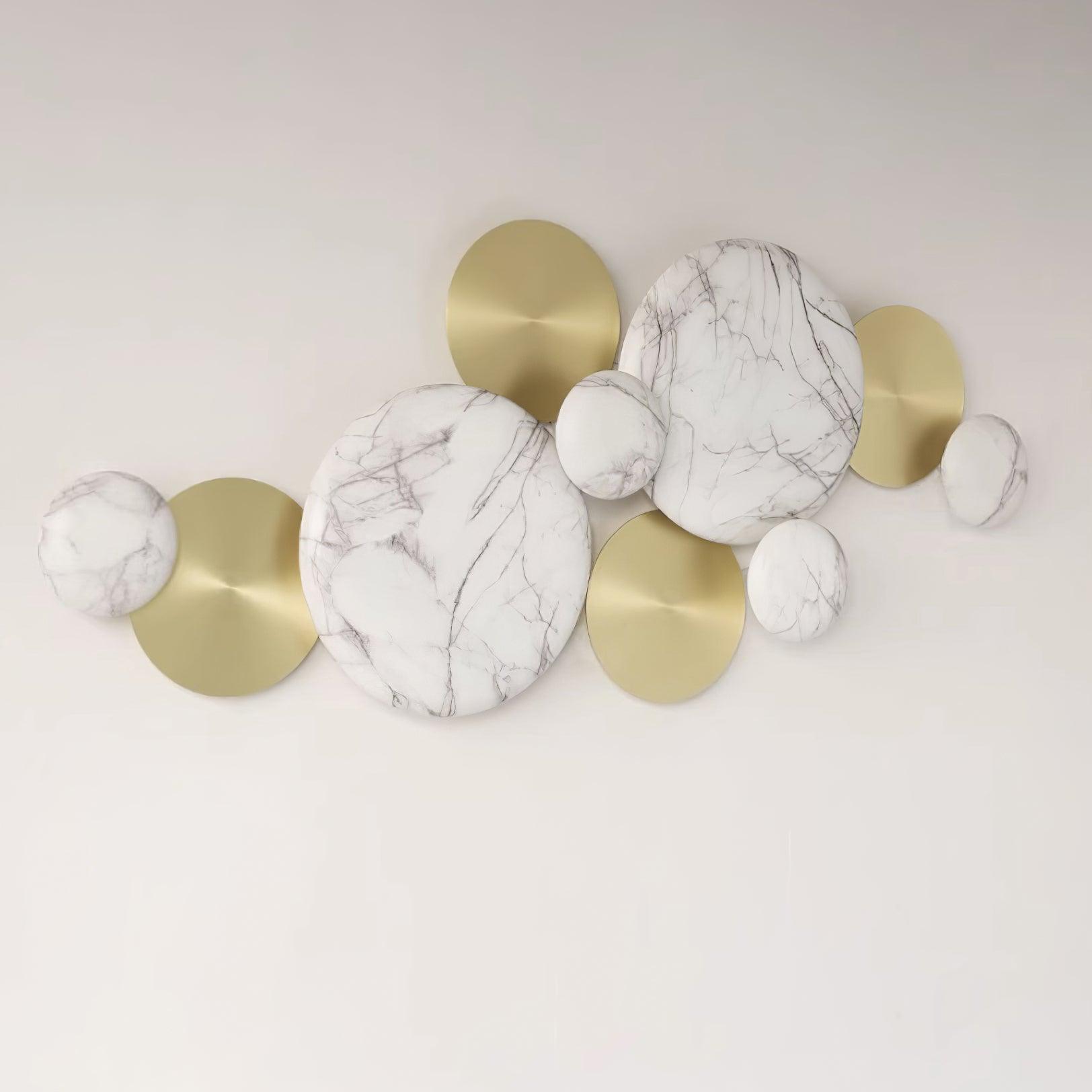 Unlit Gold & Marbling wall lamp with overlapping white gray-veined faces and flatter gold-tone discs