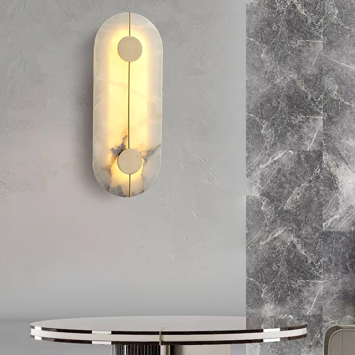 Tall patterned wall lamp above a small round table