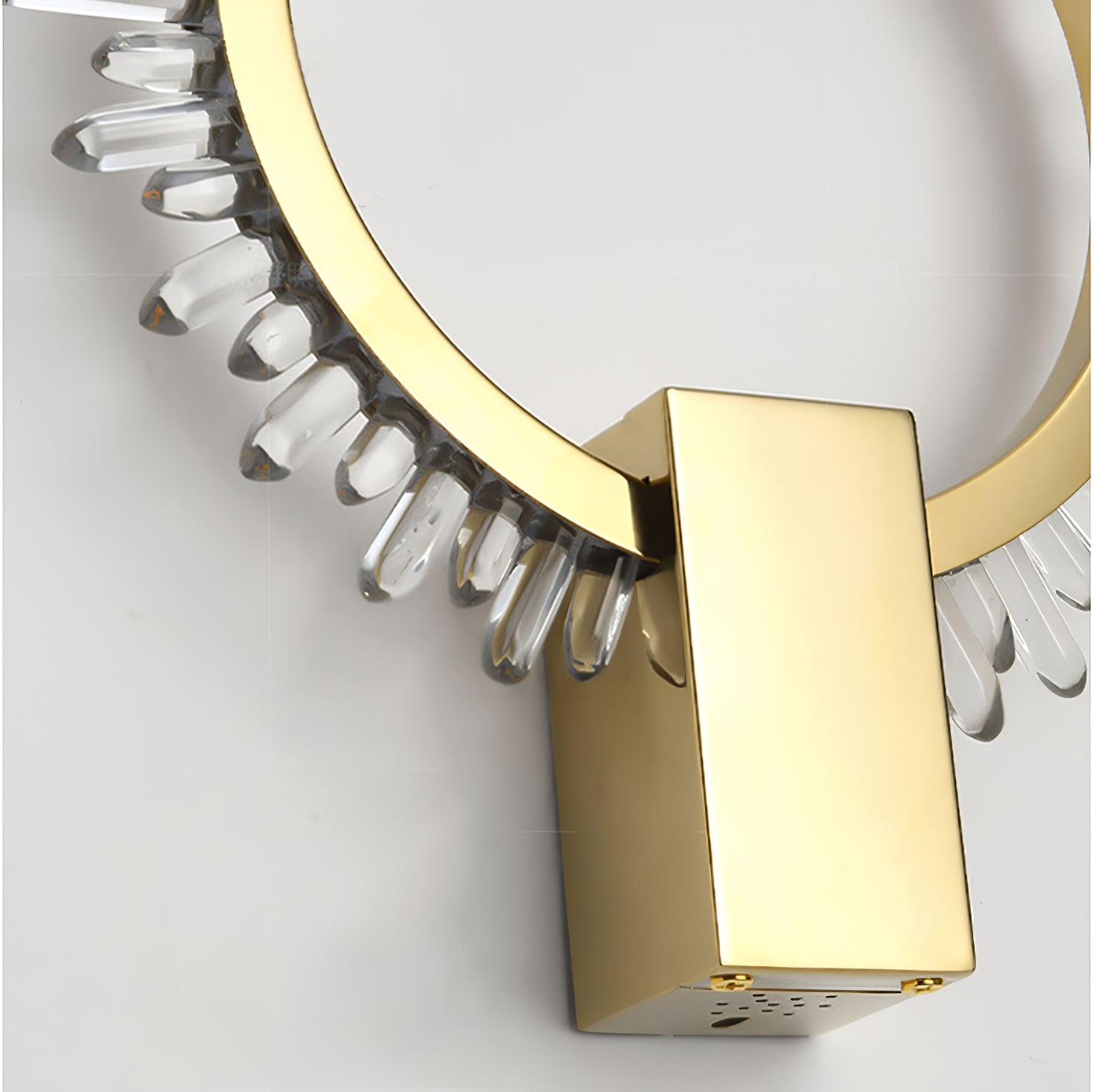 Close-up of the gold rectangular lower cover, ring joint and clear crystal pieces