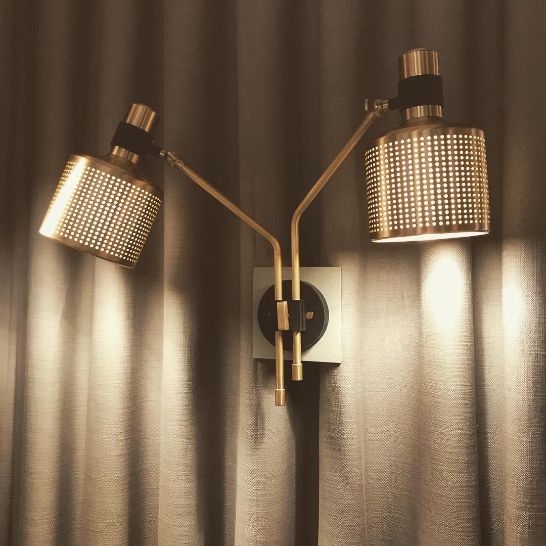 Riddle adjustable perforated metal wall light