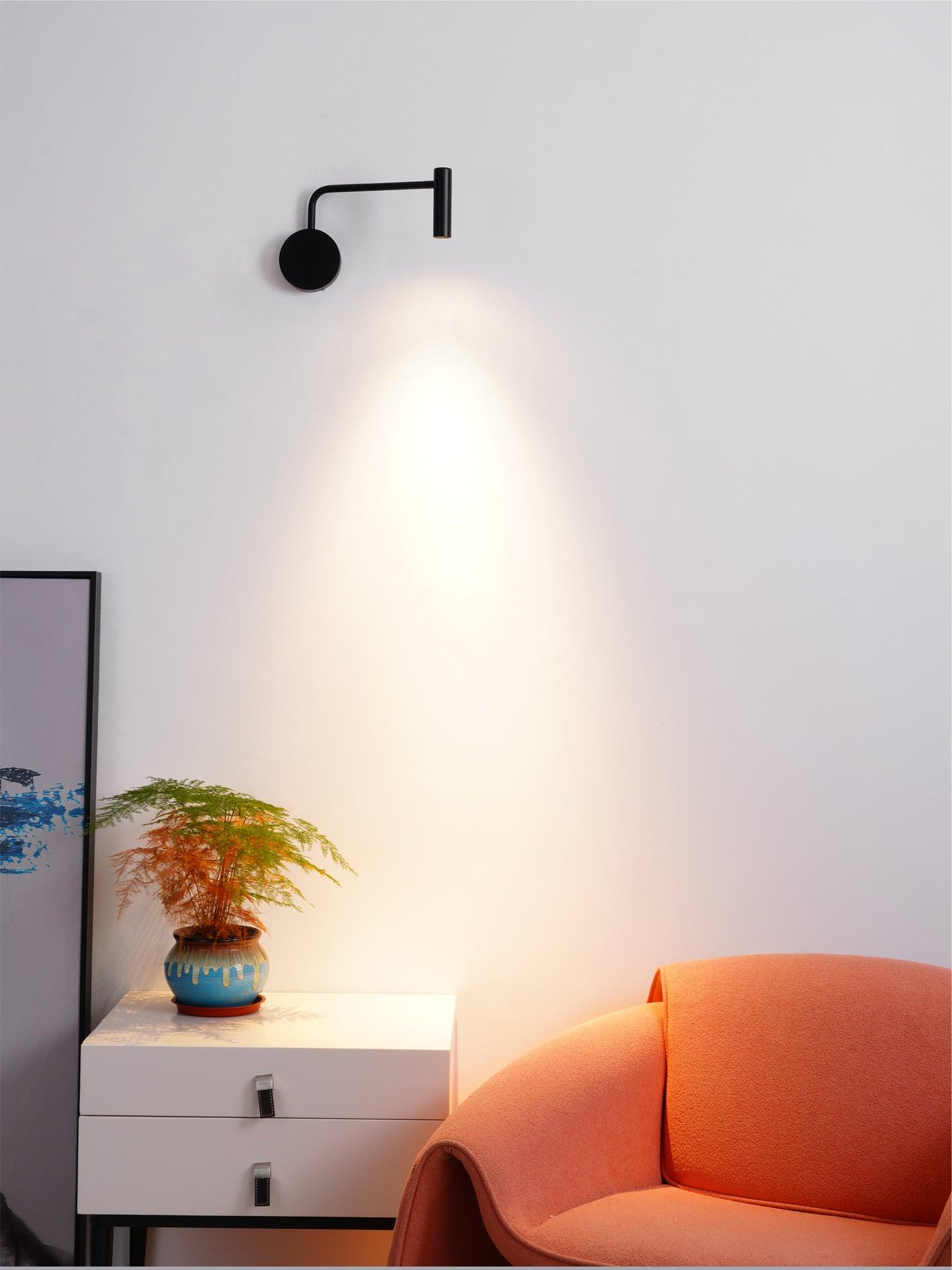 Black cylindrical head casting light over a table