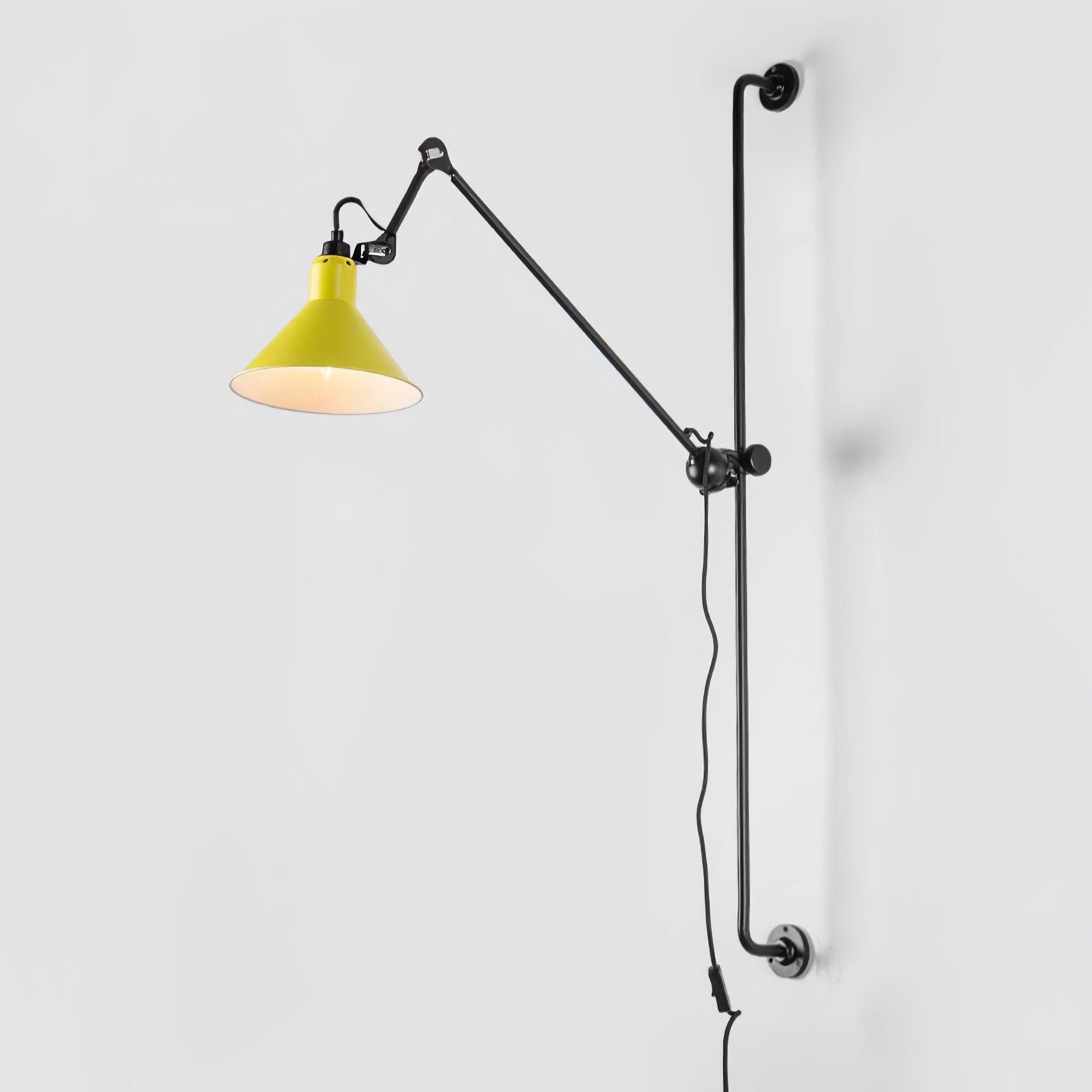 Yellow conical shade on a black wall rail and jointed arm