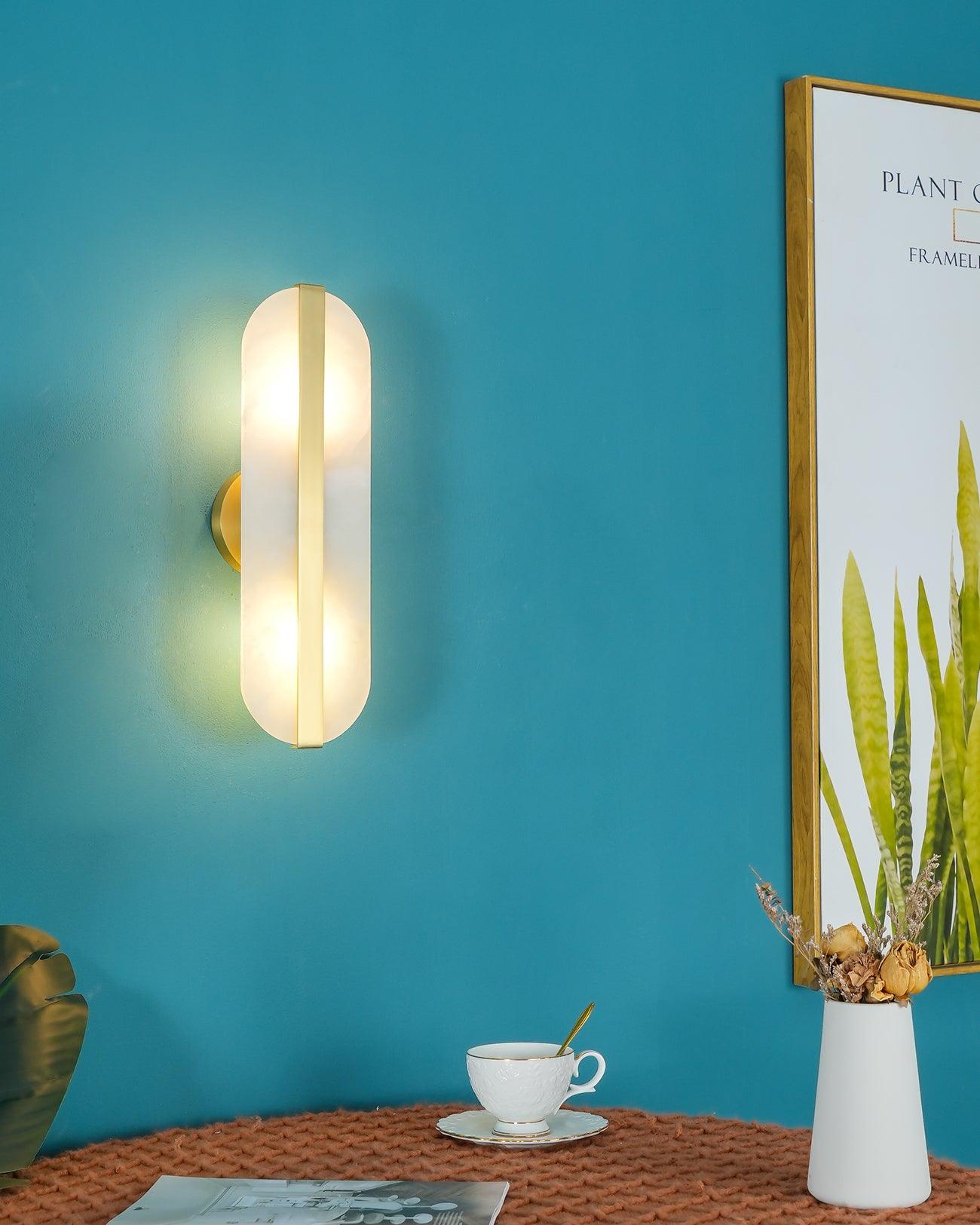 Vertical wall light beside framed artwork