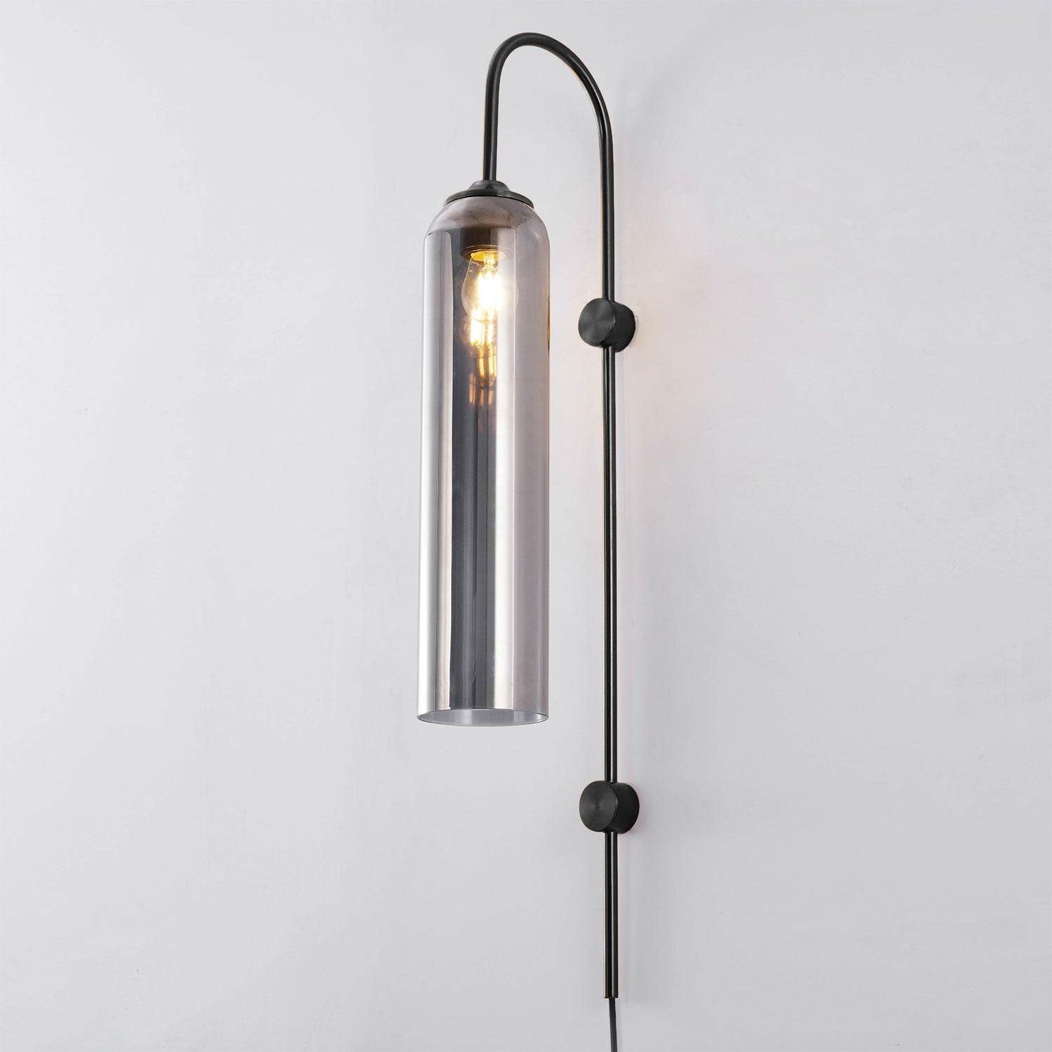 Reflective cylinder on a Black wall frame