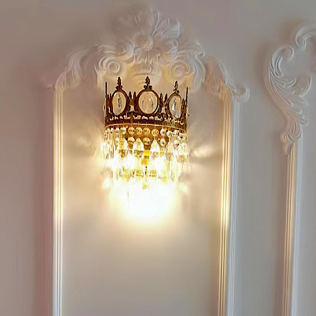 Crystal sconce inside ornate wall moulding