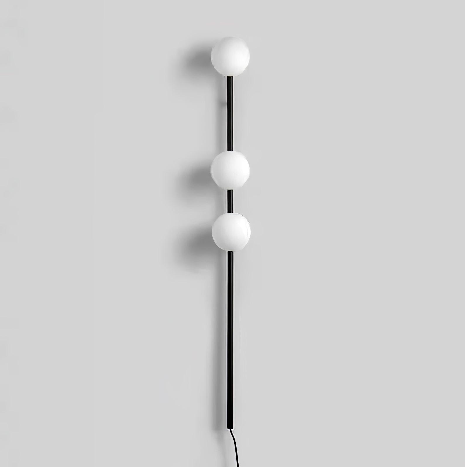 Black option image, three unlit white globes along slim black rod with long lower extension and black cord