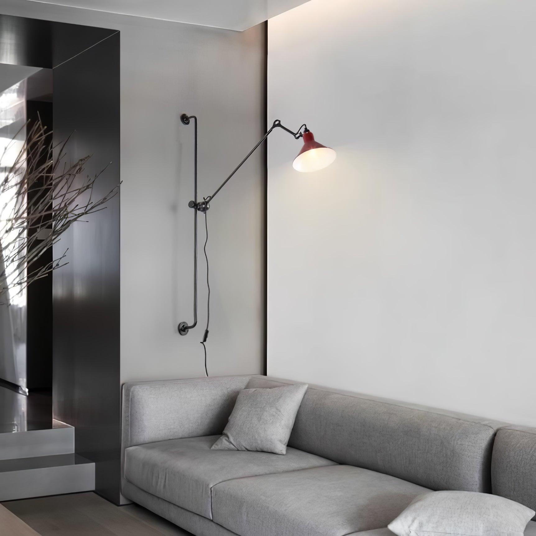 Pair of jointed wall lamps above a sofa