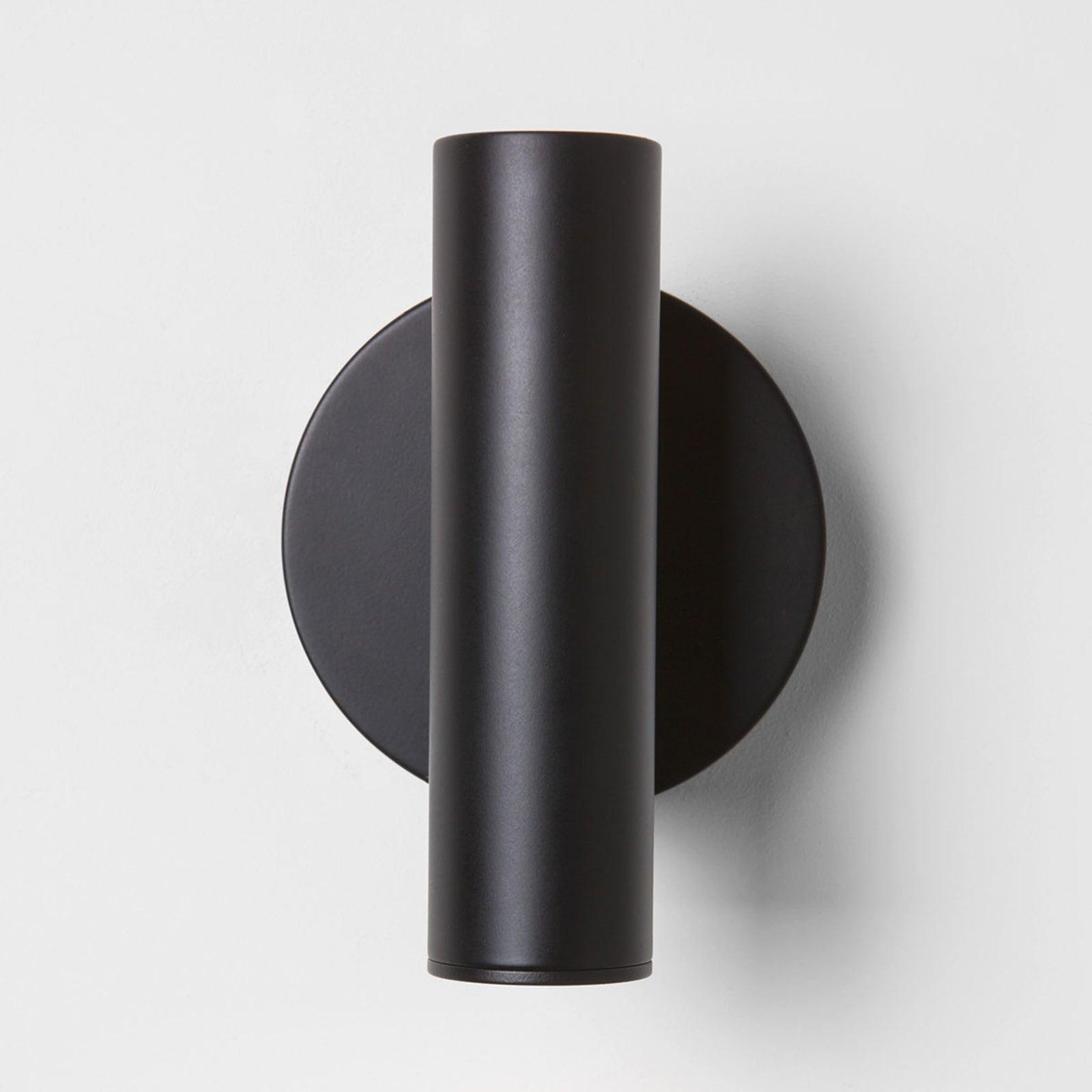 Front view of Black cylindrical head and round plate