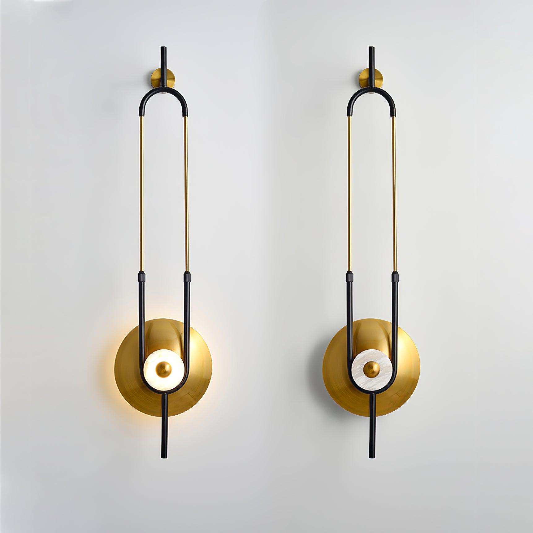 Two matching Ellipse Ring wall lights side by side, left ring illuminated and right ring unlit with visible texture
