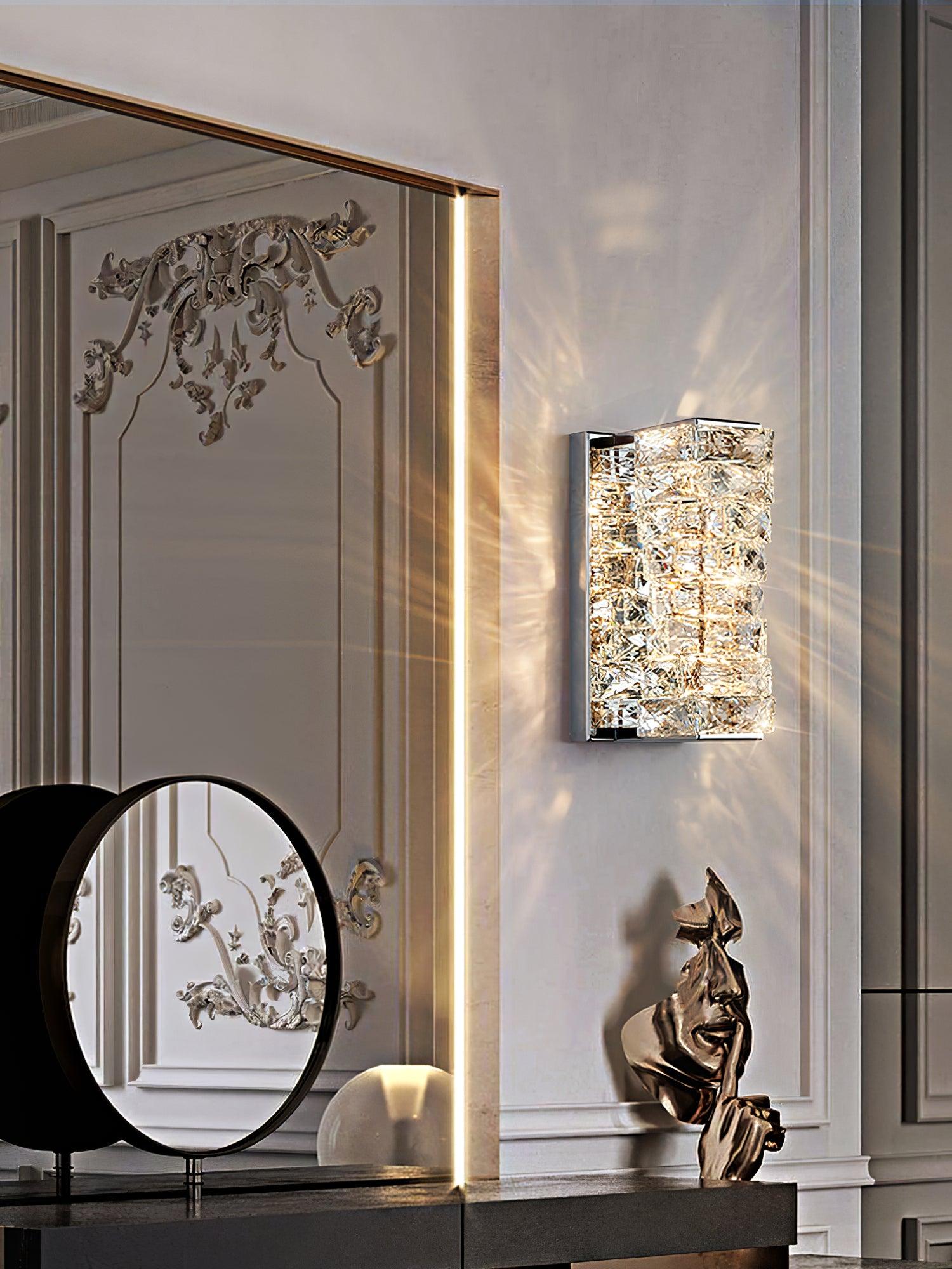 Chrome crystal wall light beside a mirror