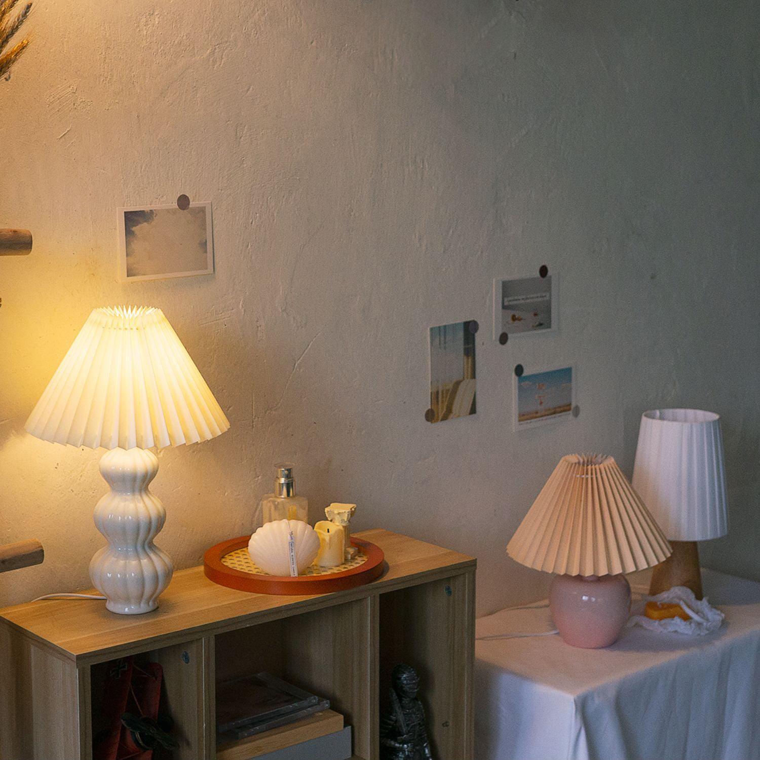 Leo on a cabinet with other table lamps nearby