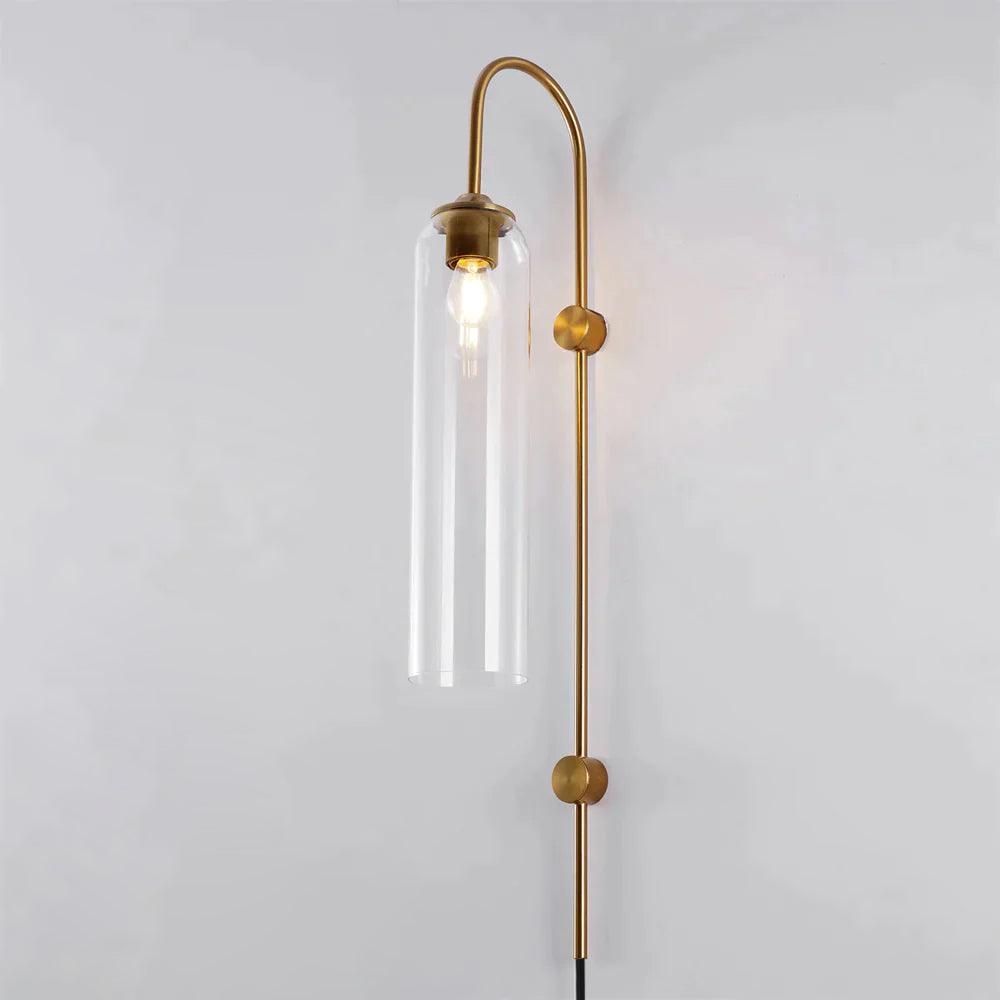 Clear glass tube on a gold-coloured wall arm with two circular fixing points