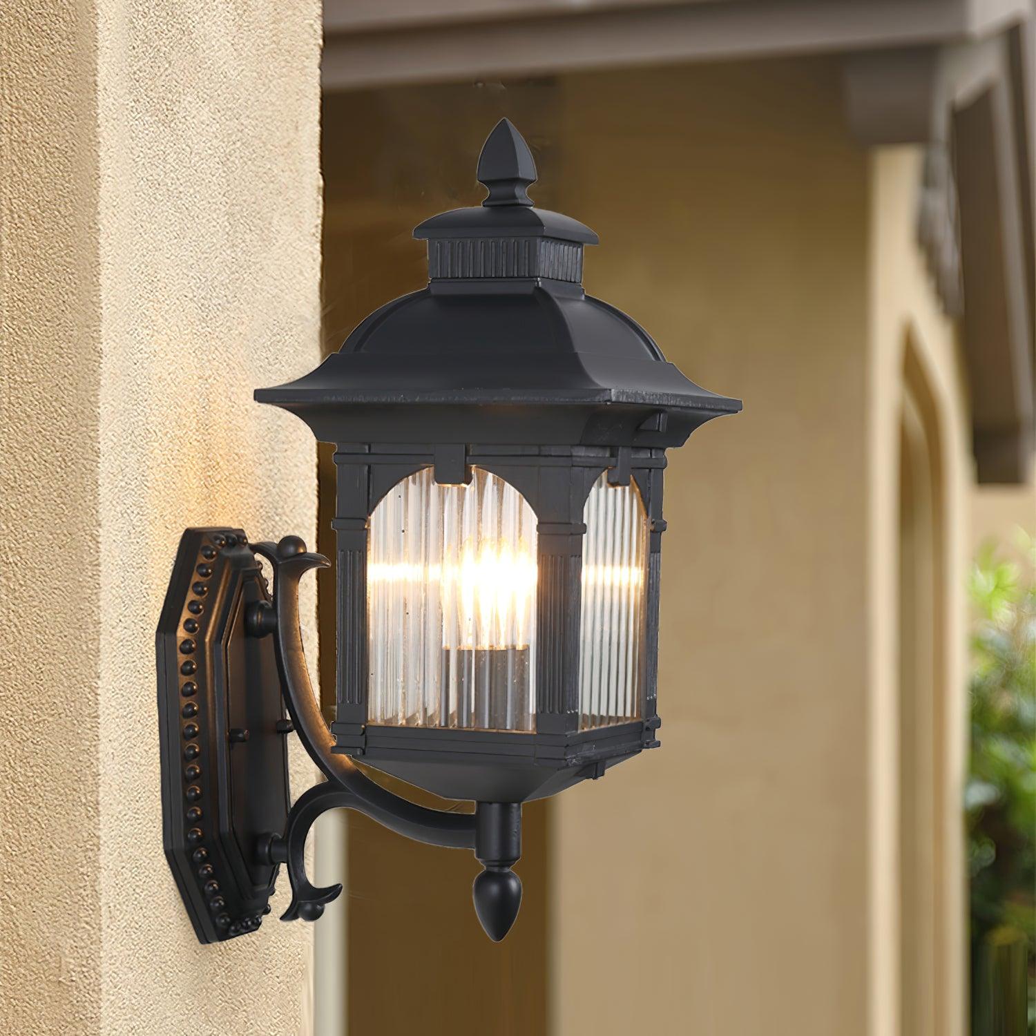 Illuminated black Miller lantern on a warm-toned exterior wall