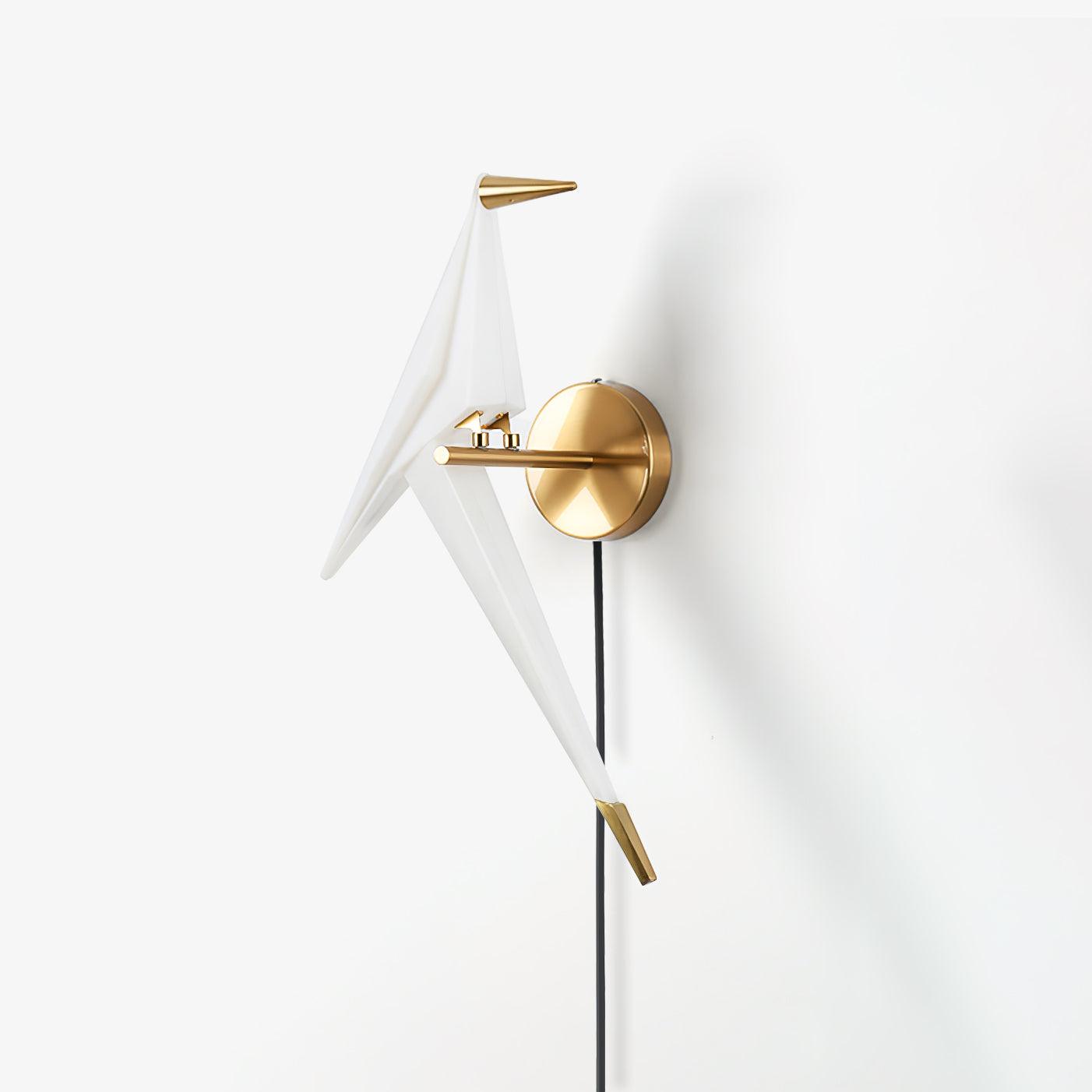 Isolated unlit-looking White bird on a Gold arm and round backplate, with a Gold-tipped tail and Black cable against white