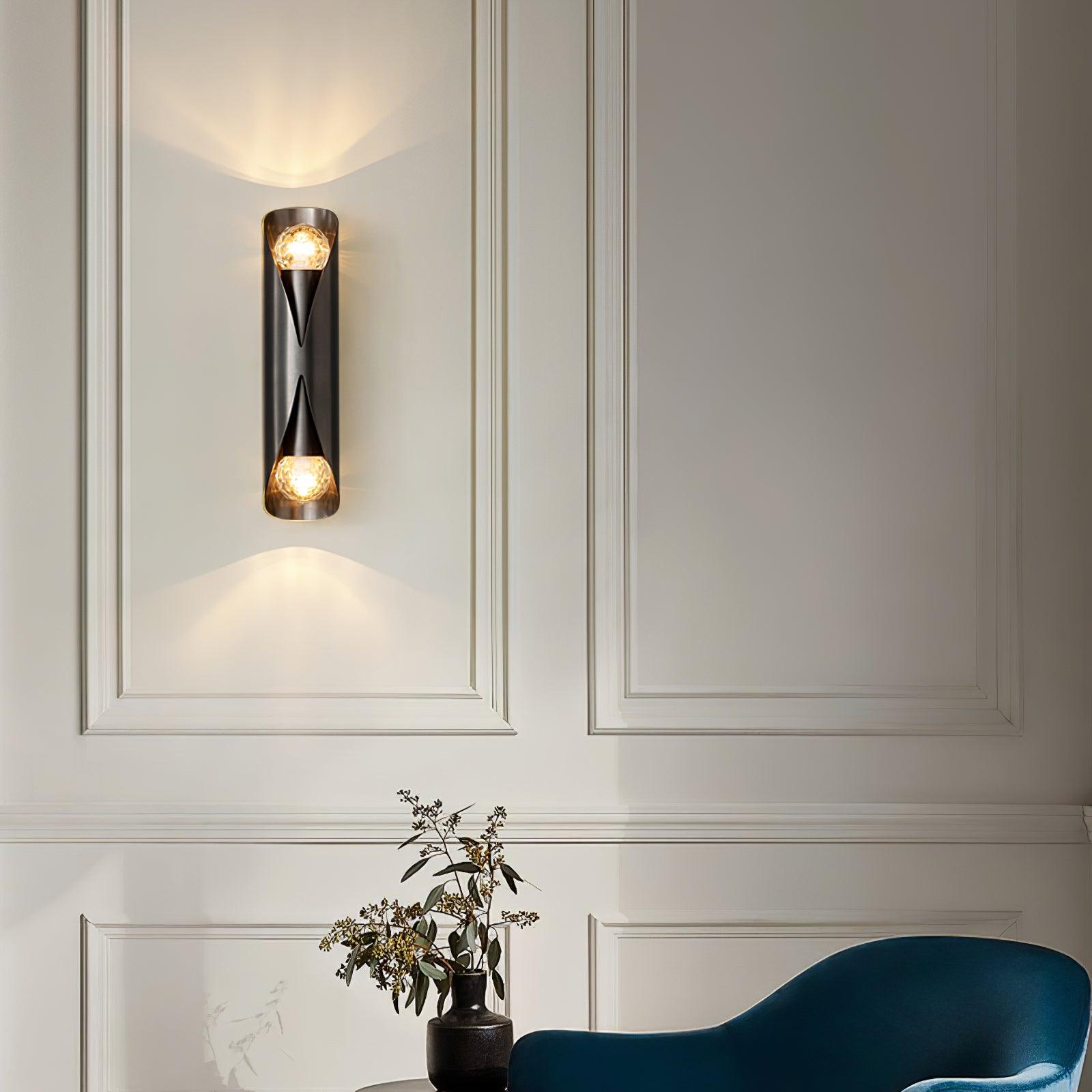 Black dual-ended lamp on a panelled wall