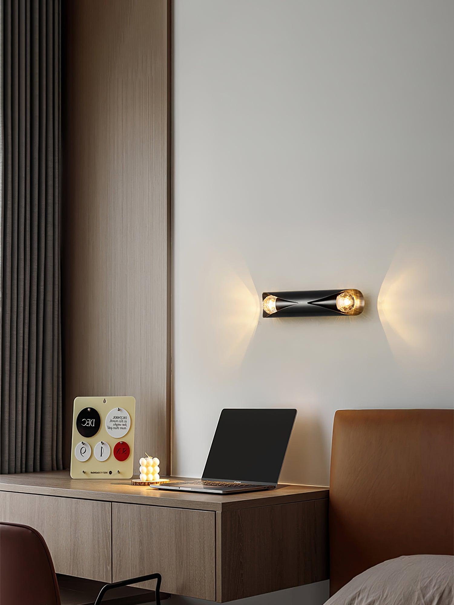 Horizontal Black wall light near a laptop
