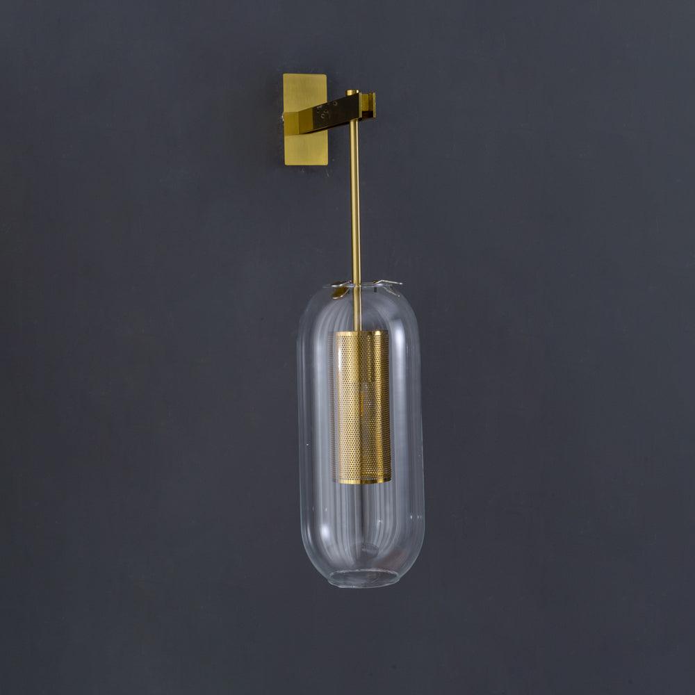 Close view of suspended glass and perforated cylinder