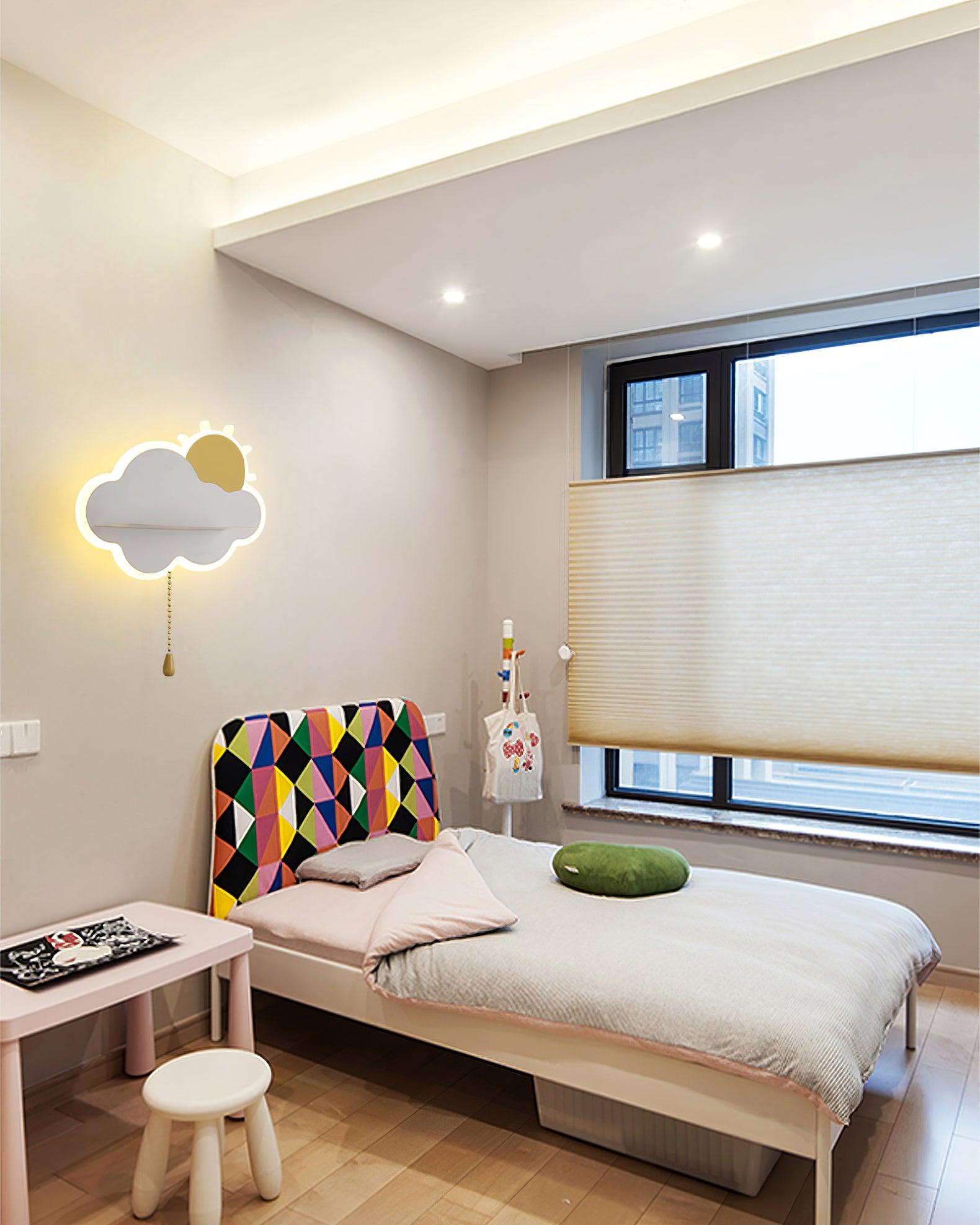 White cloud lamp beside a bed in a pale room