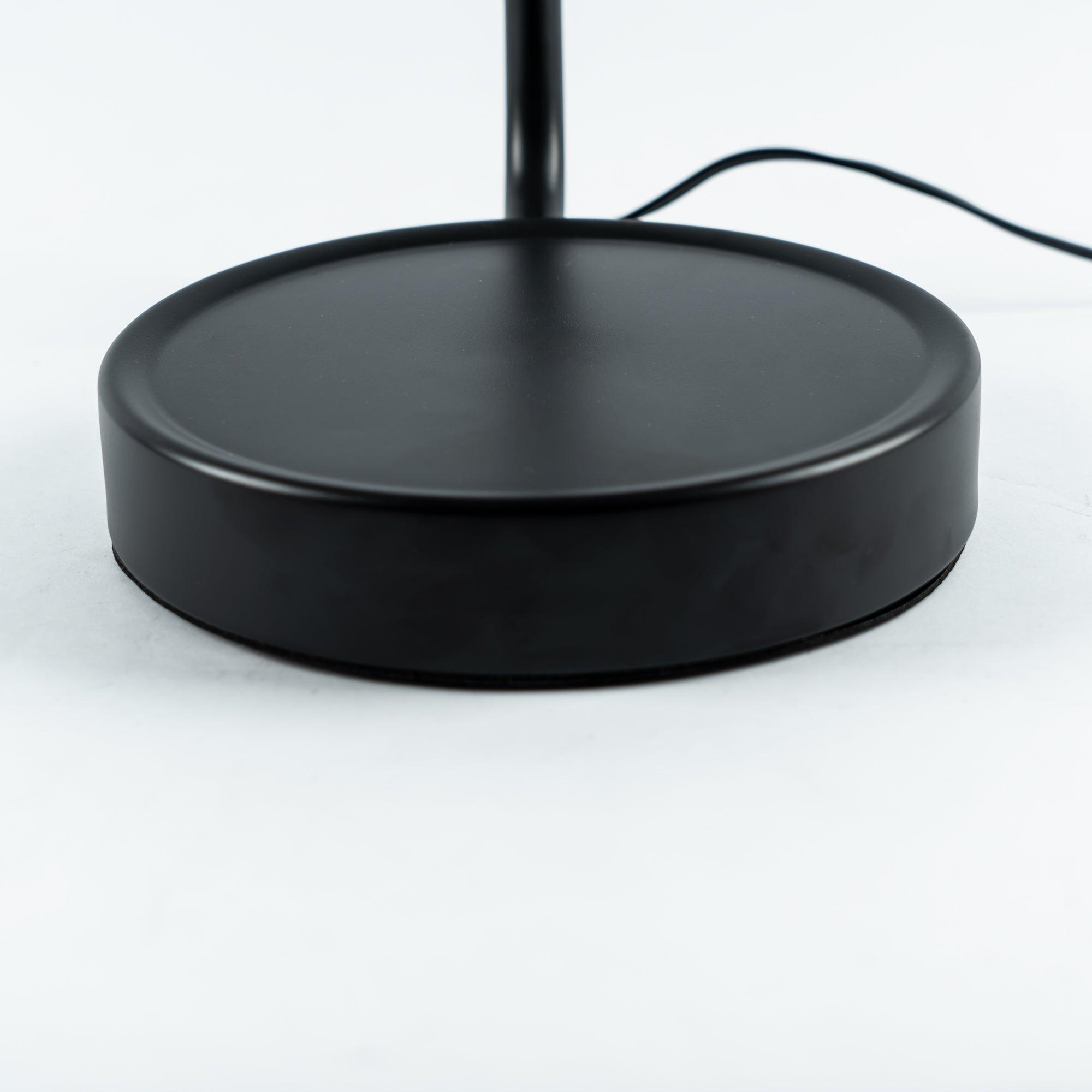 Close-up of Mona black circular base and cable