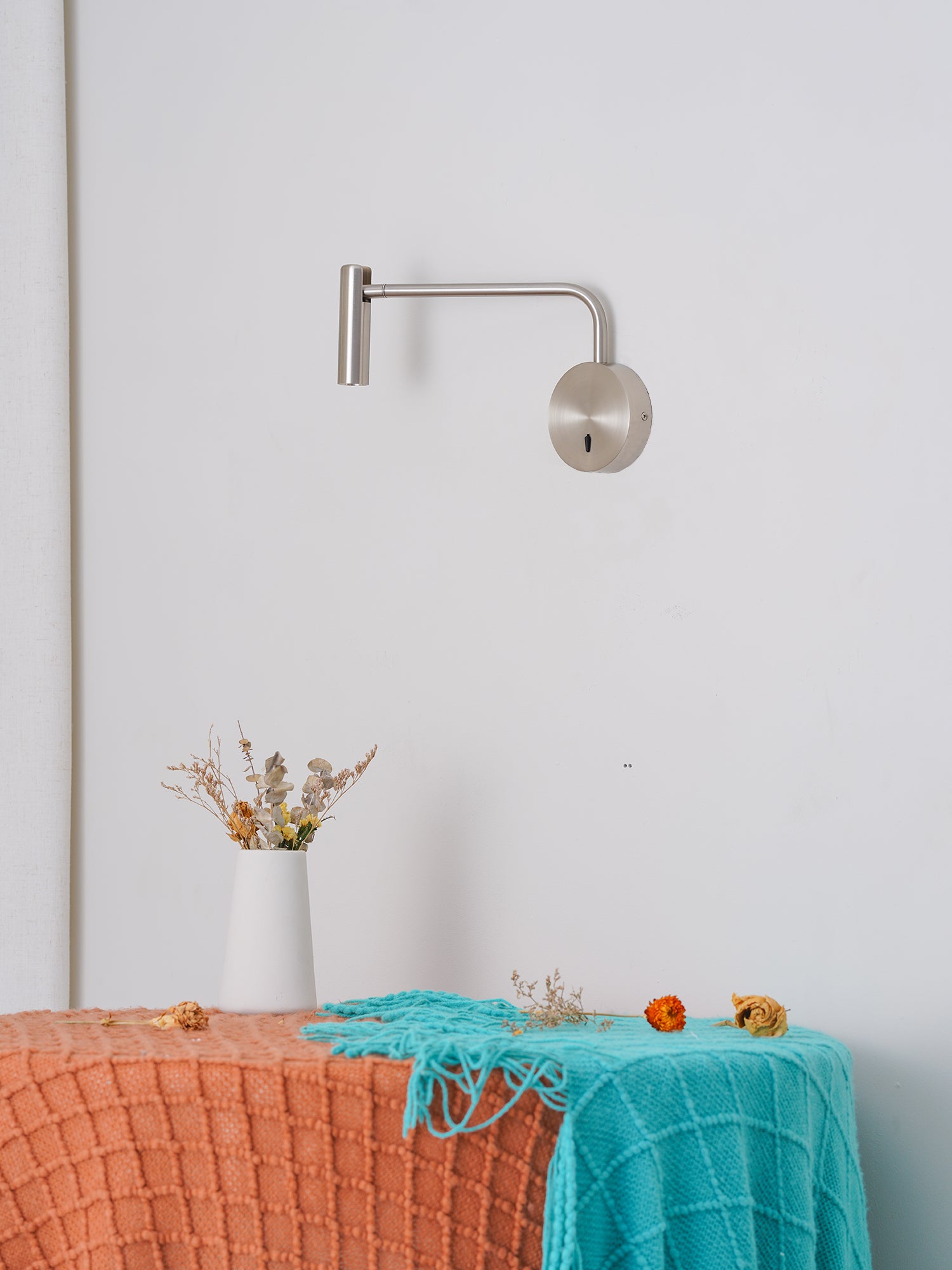 Brushed wall light in an indoor arrangement