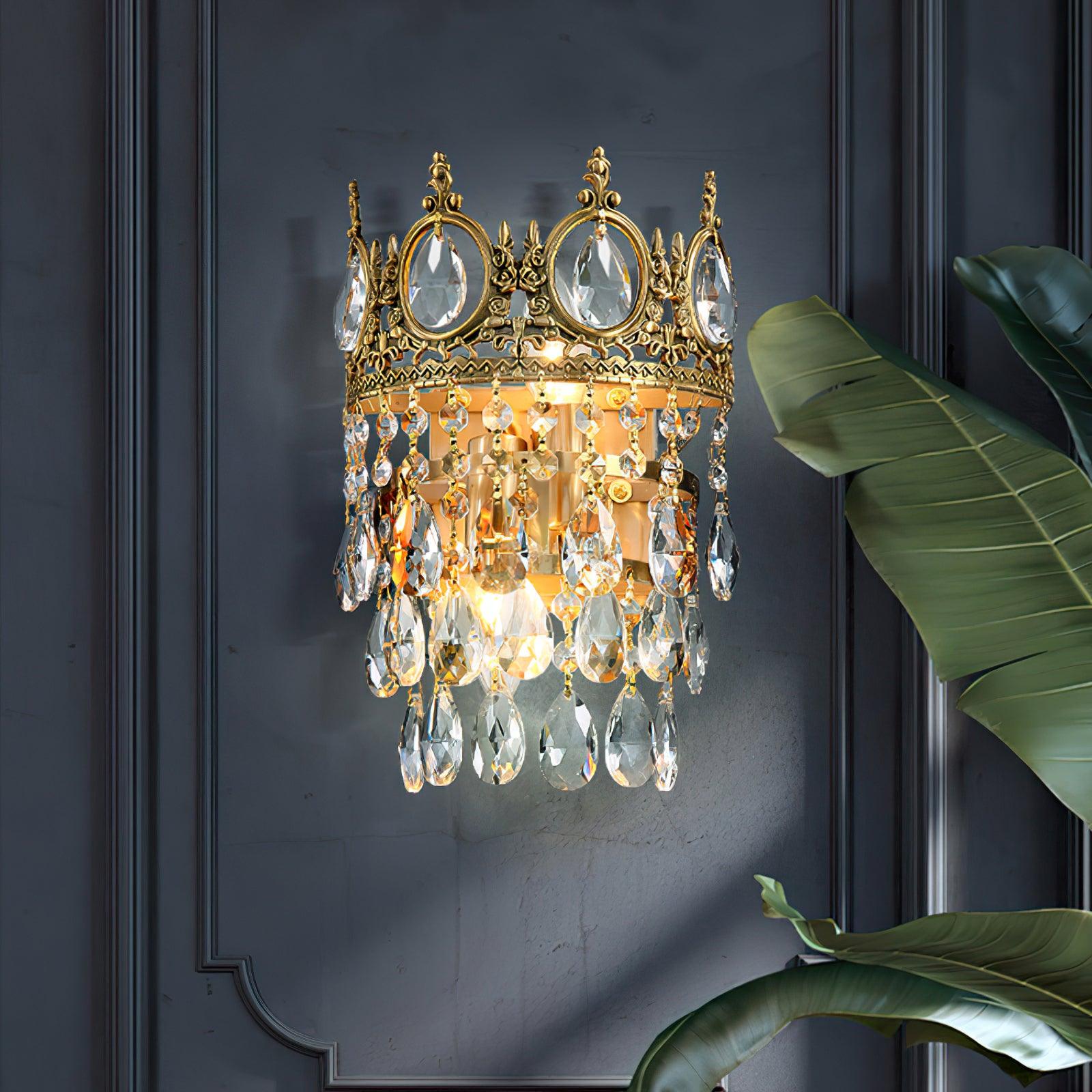 Crystal wall lamp against a dark blue panel