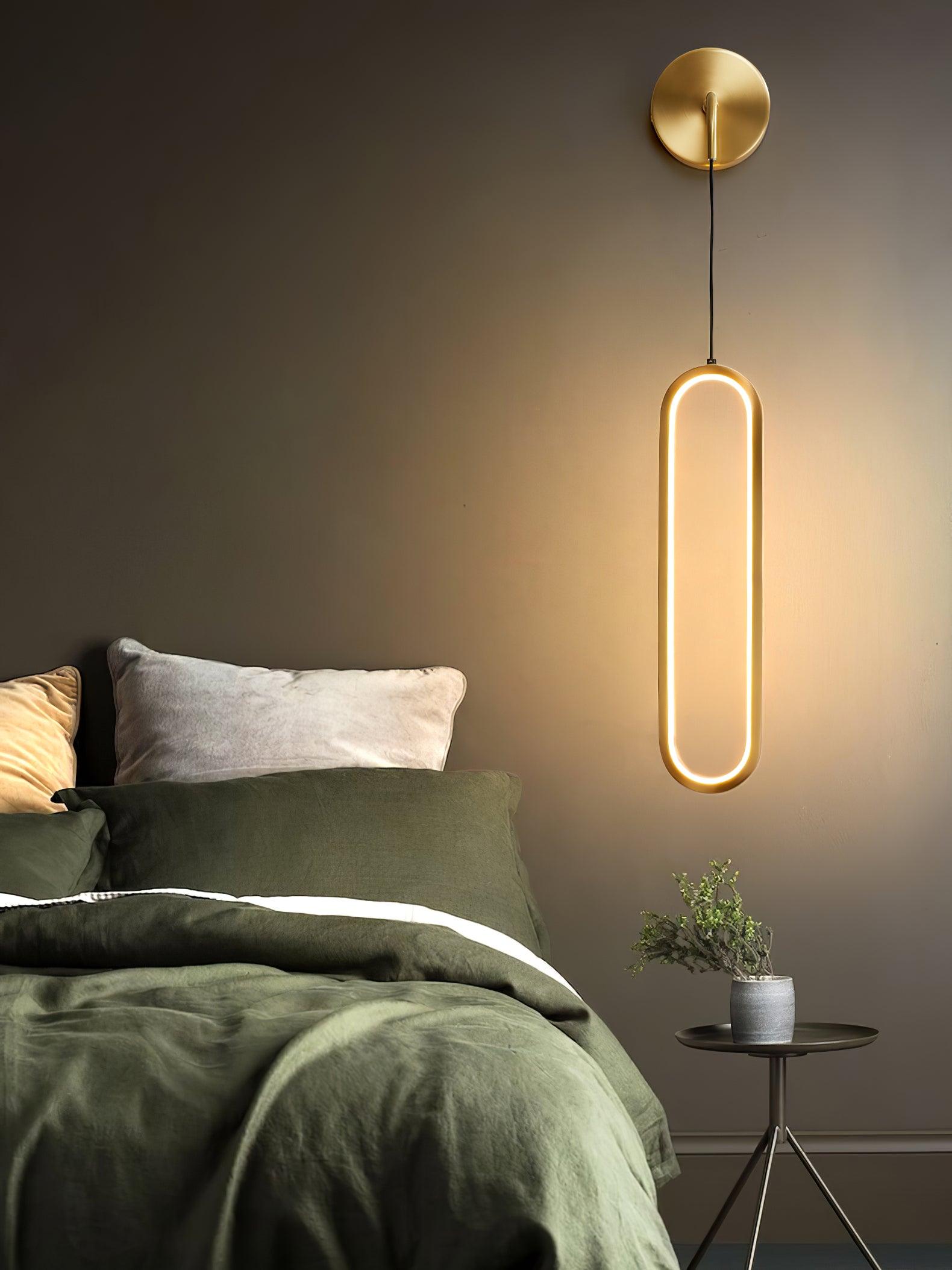 Brass oval ring beside a green bedspread