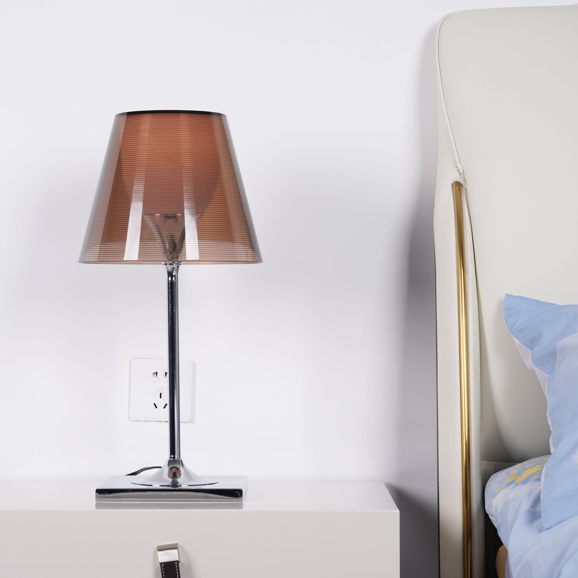 Bronze-shade Chrome Prism lamp on a bedside cabinet