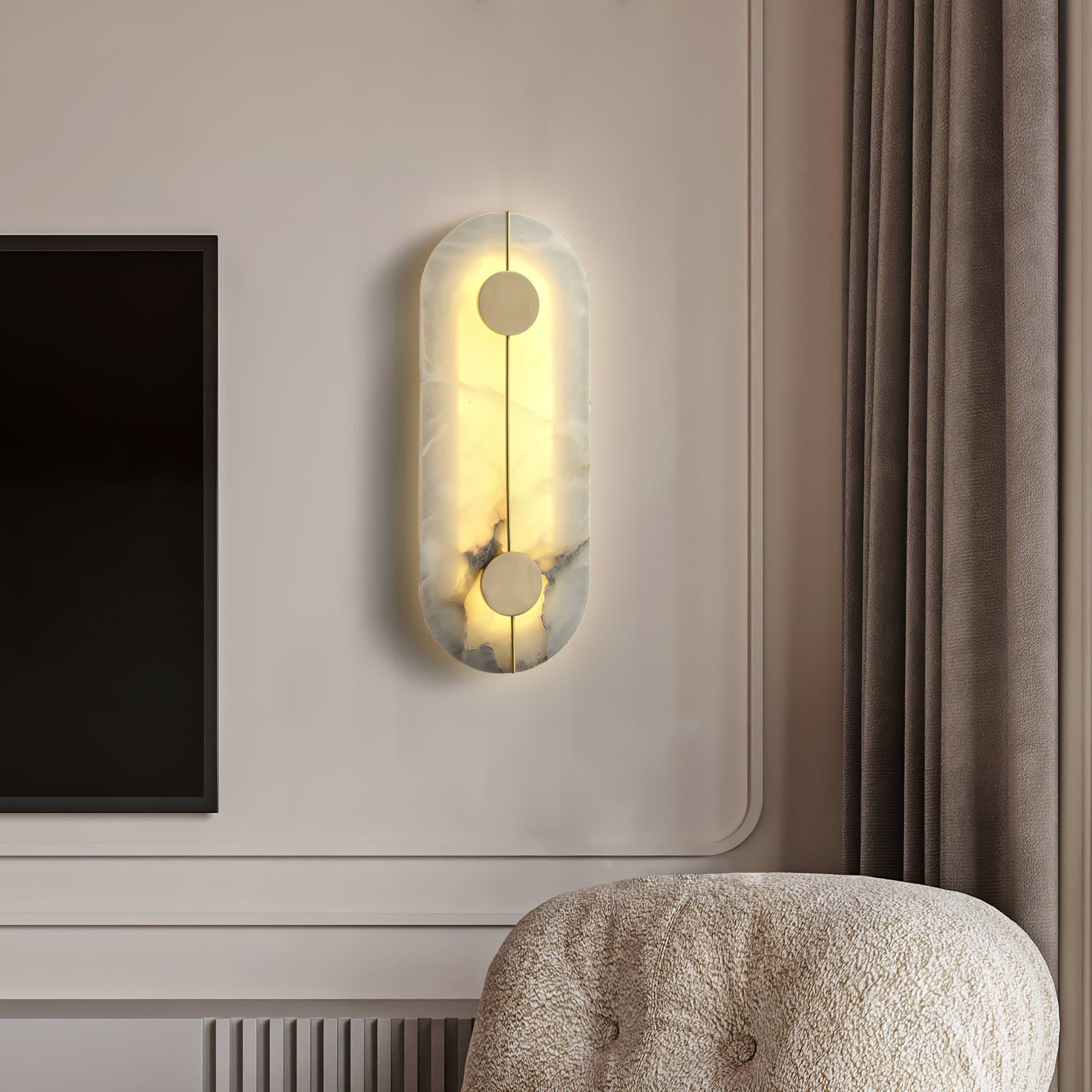 Vertical patterned wall light near framed artwork