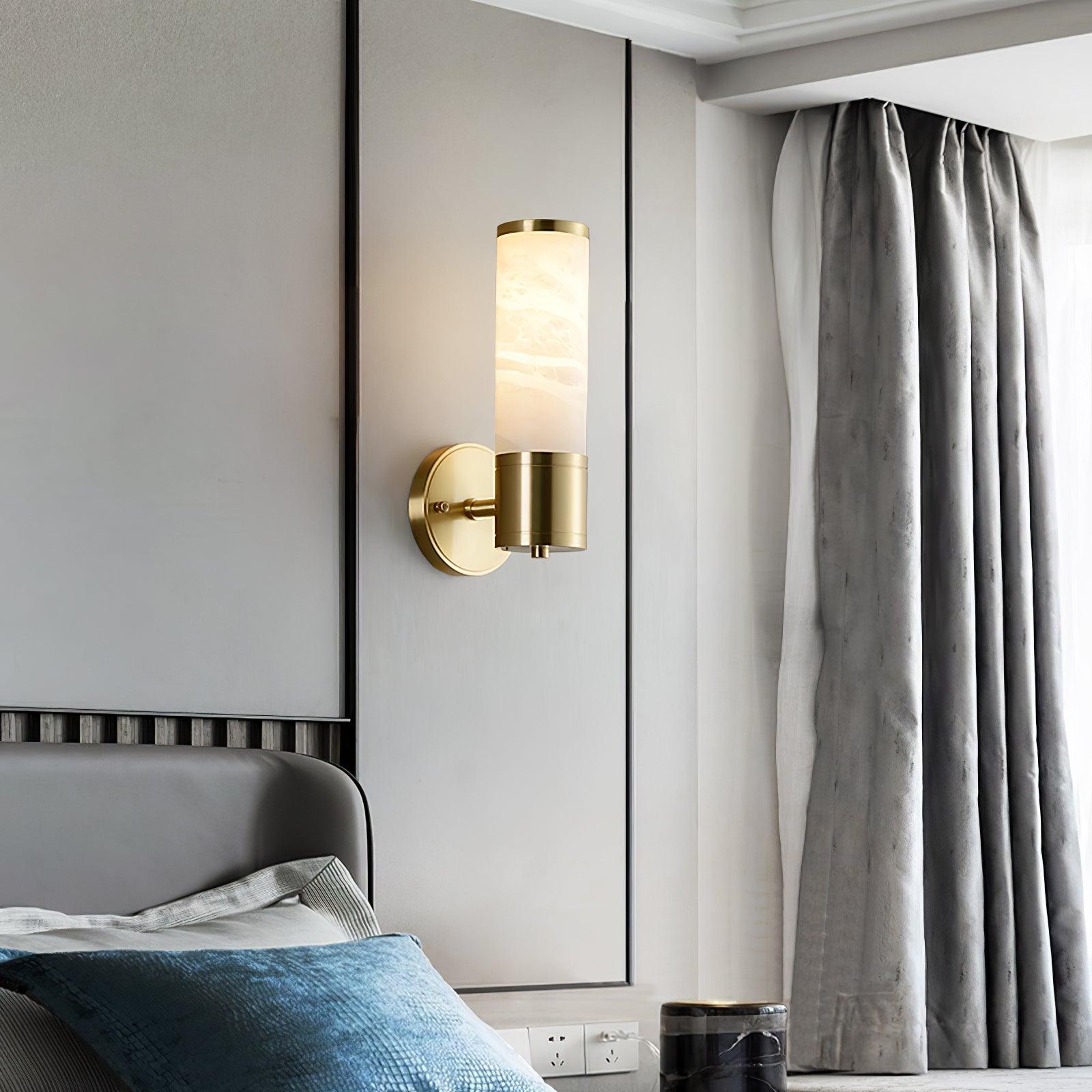 Tall Lampatron wall light beside a bed and window