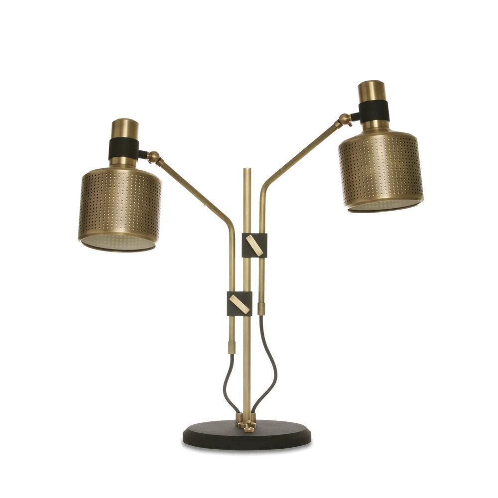 Gold-and-black double-head table lamp with two perforated shades, staggered arms and one shared black round base