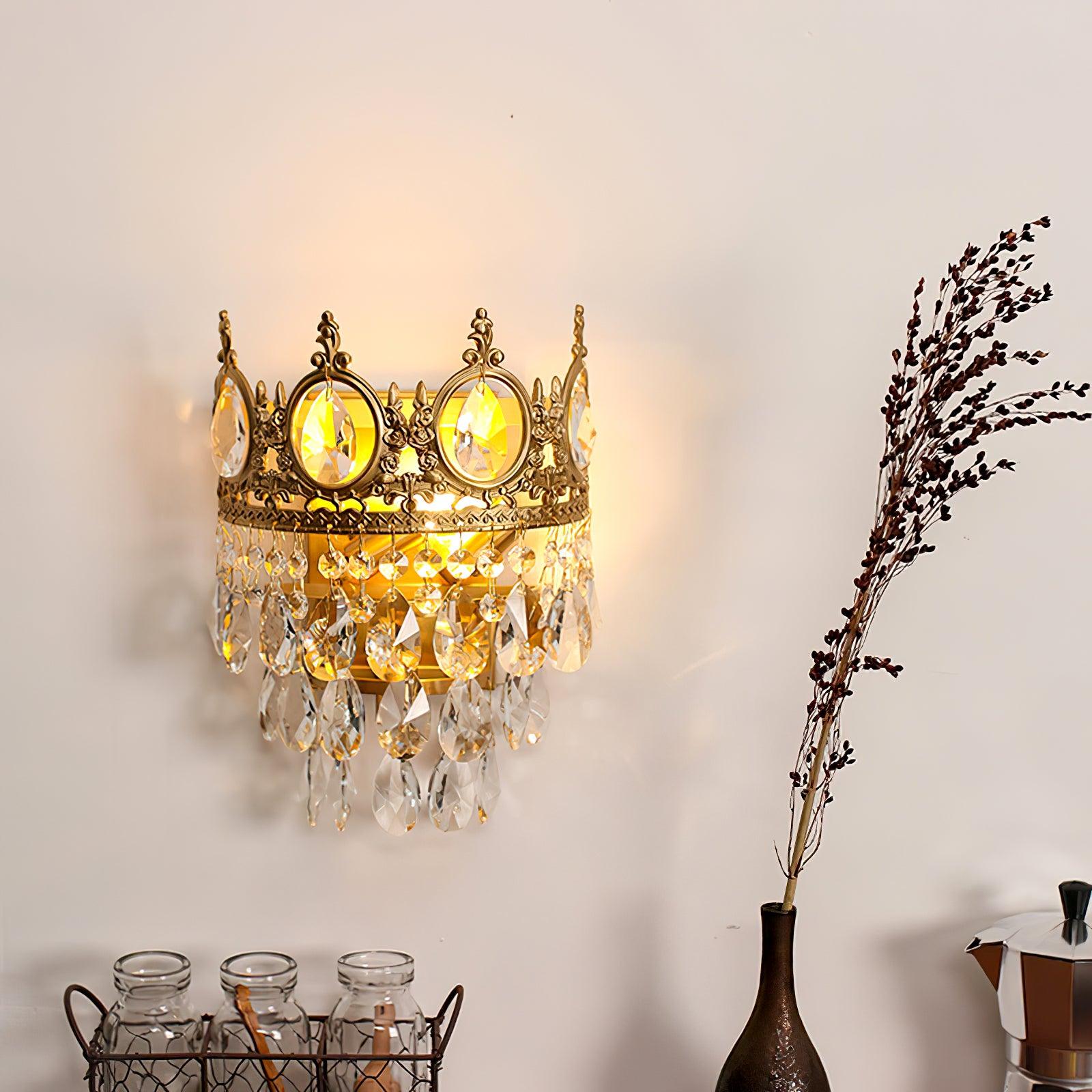 Crystal crown sconce above a decorative console