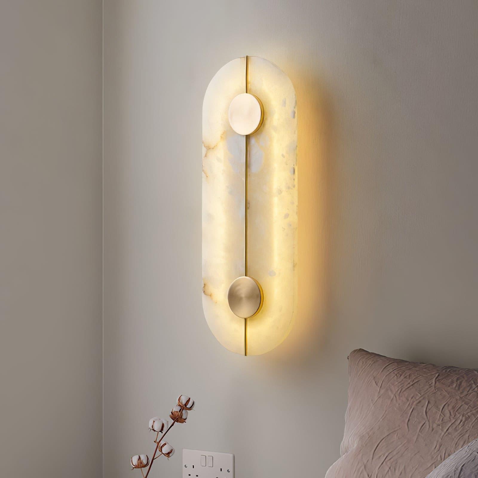 Illuminated capsule panel beside pale bedding