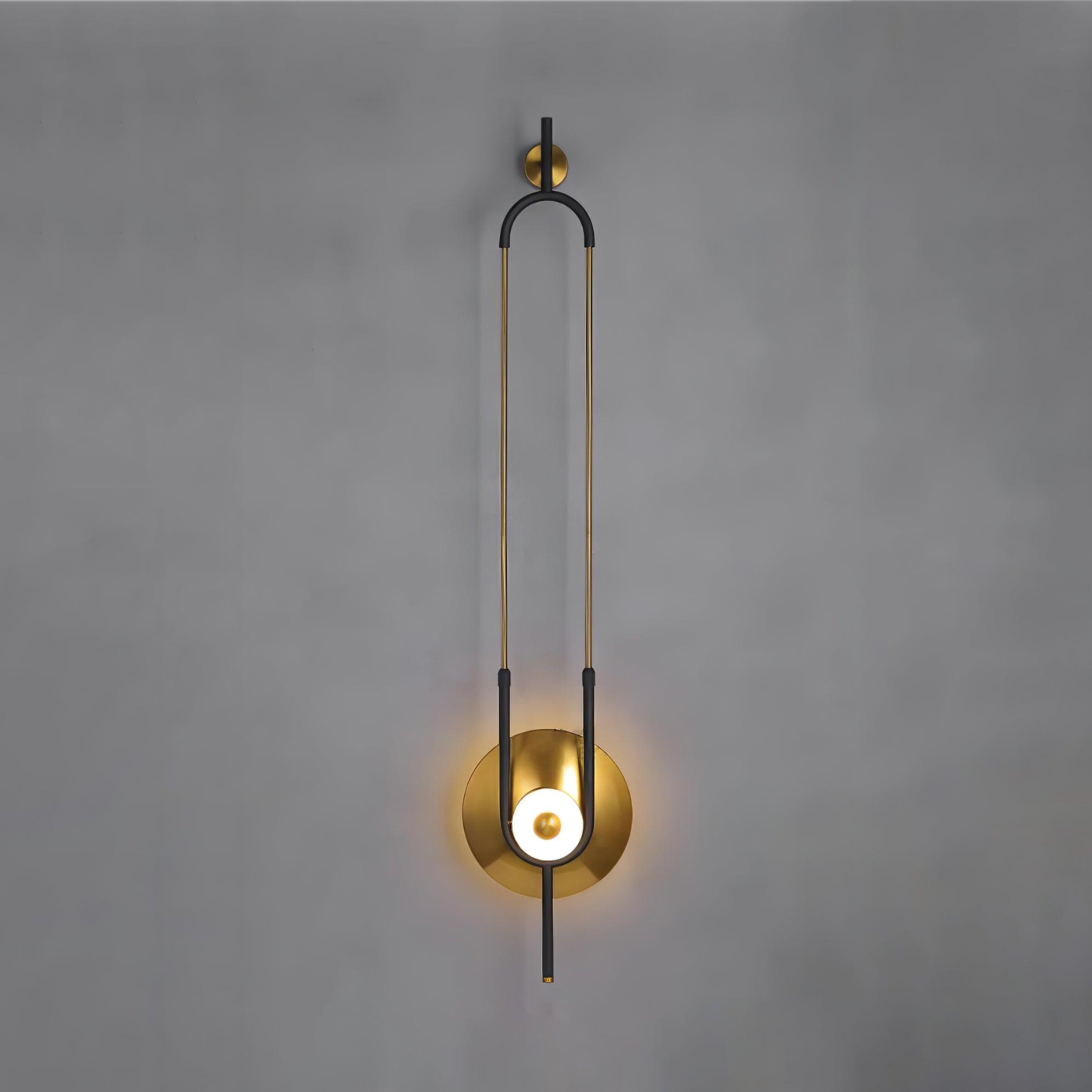 Full elongated loop wall light with glowing white centre ring on grey studio background