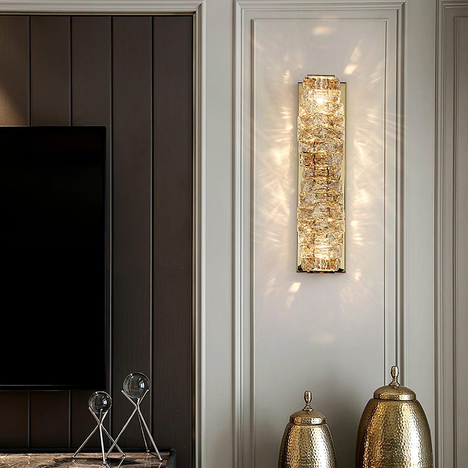 Tall Gold crystal light above decorative vessels