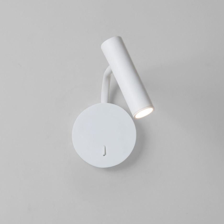 White circular-base light with tilted head
