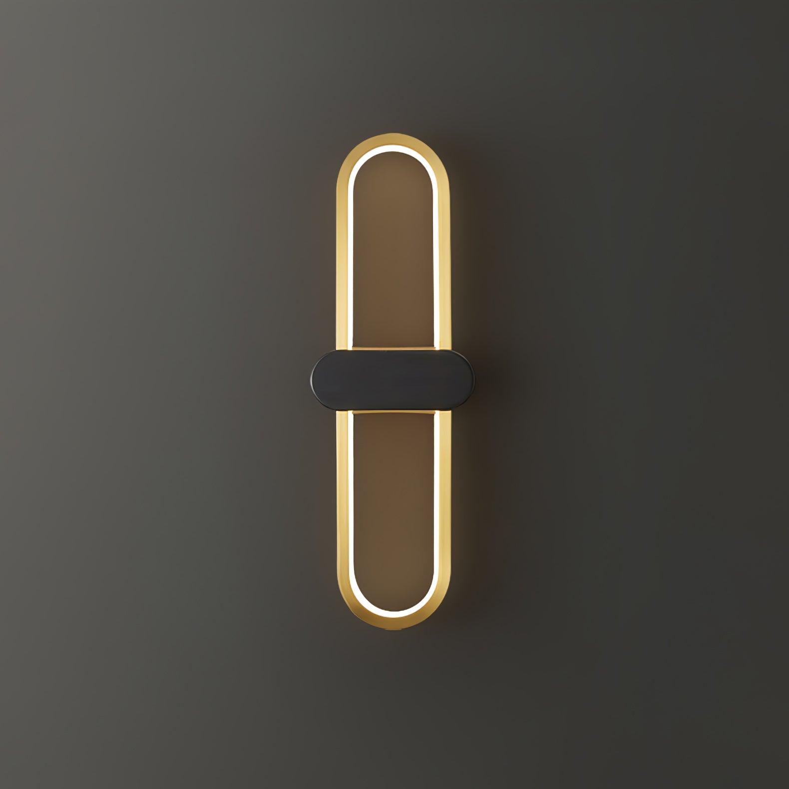 Lit gold oval loop with a black centre cover and white light strip along its inner edge