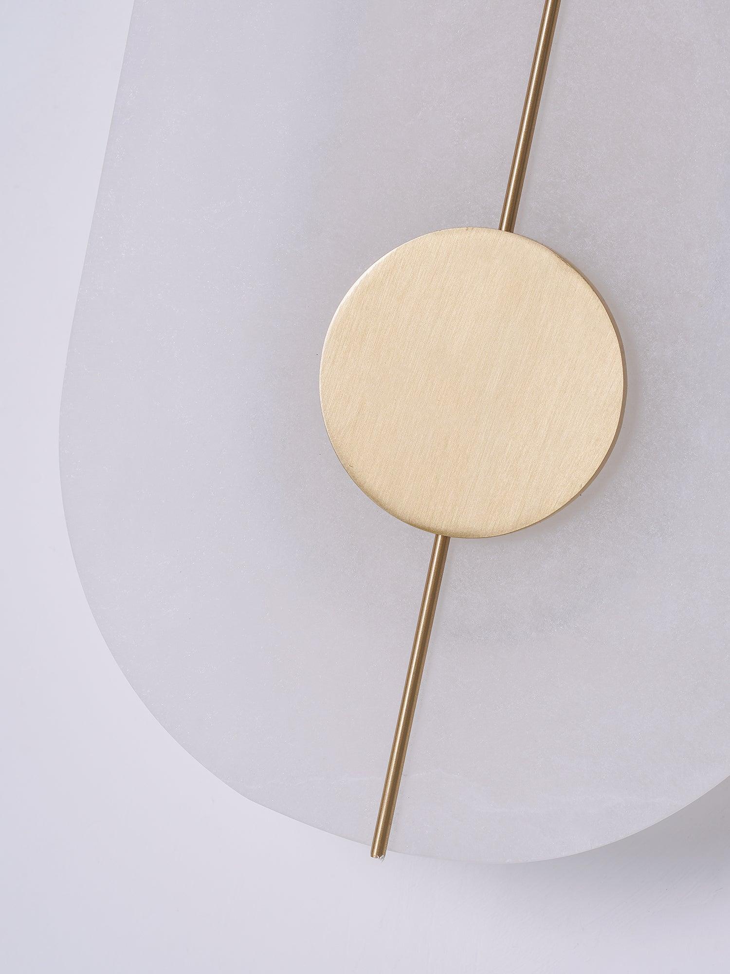 Unlit round face and brass-coloured disc detail