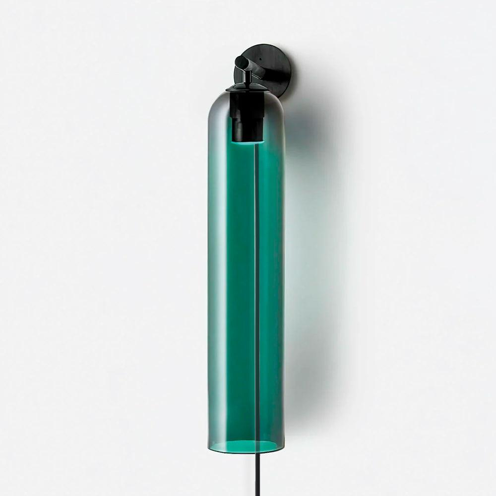 Green glass cylinder showing the black inner fitting