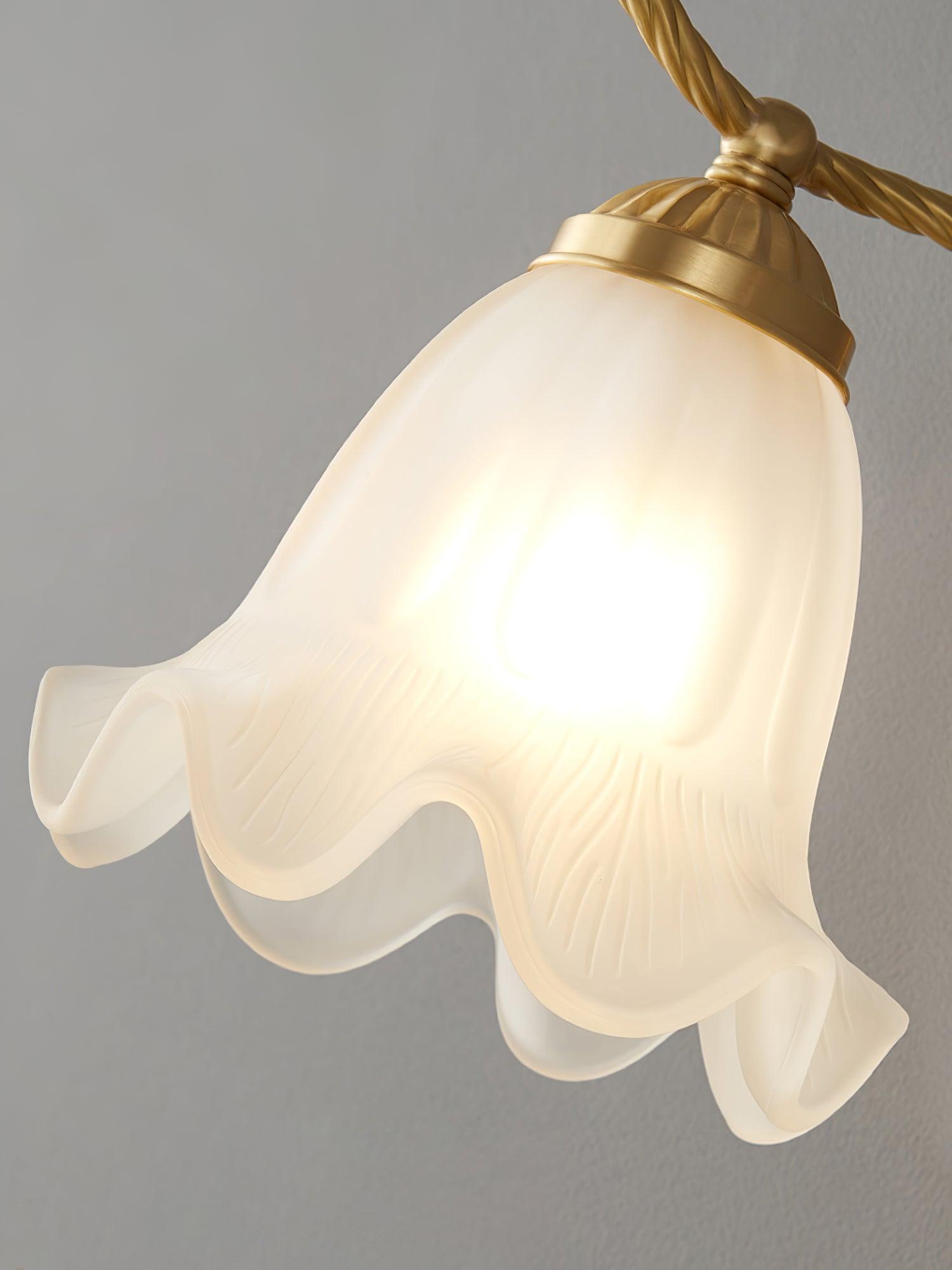 Close-up of glowing opaque white glass shade with elongated flutes, fine texture and wavy scalloped edge