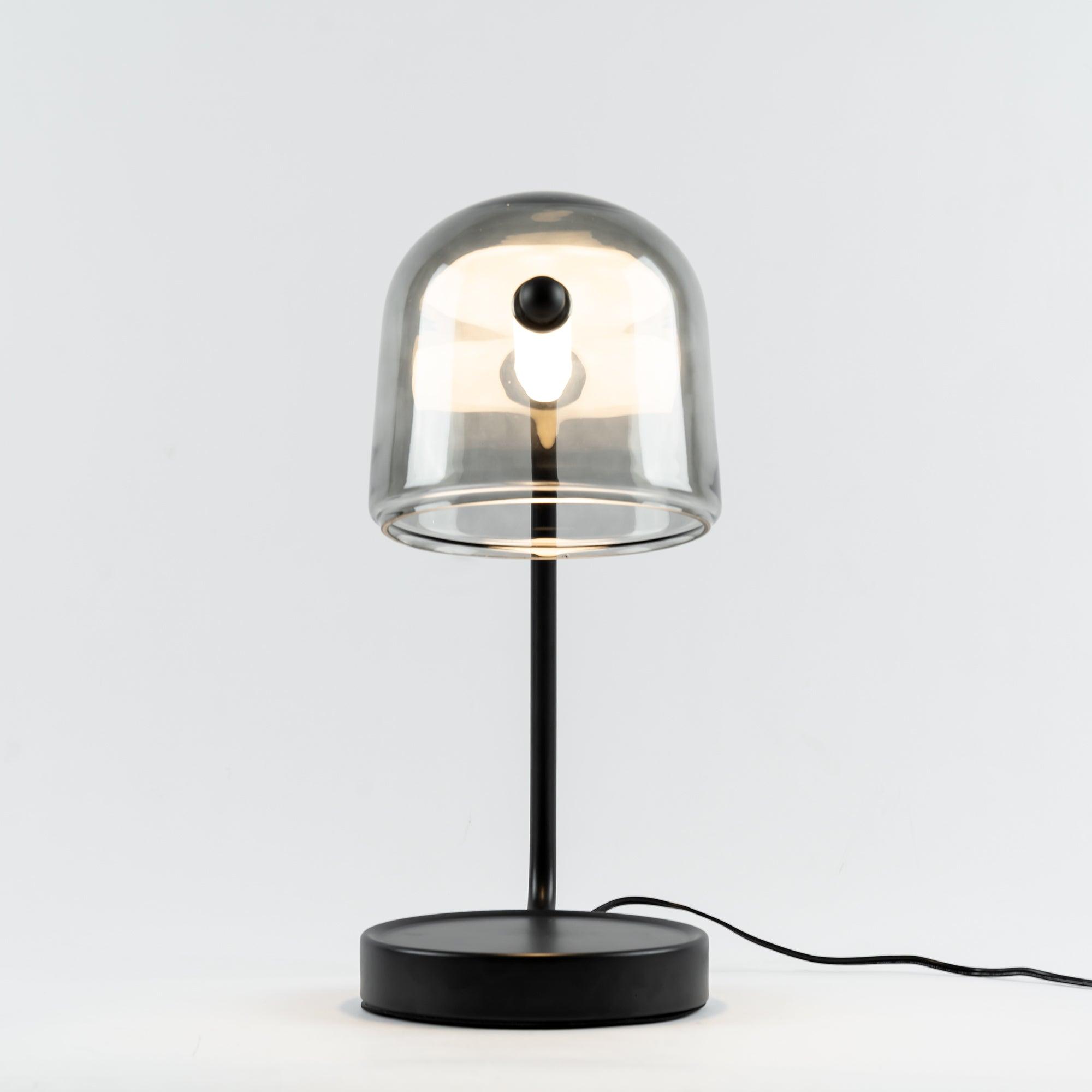 Front view of illuminated Mona glass lamp