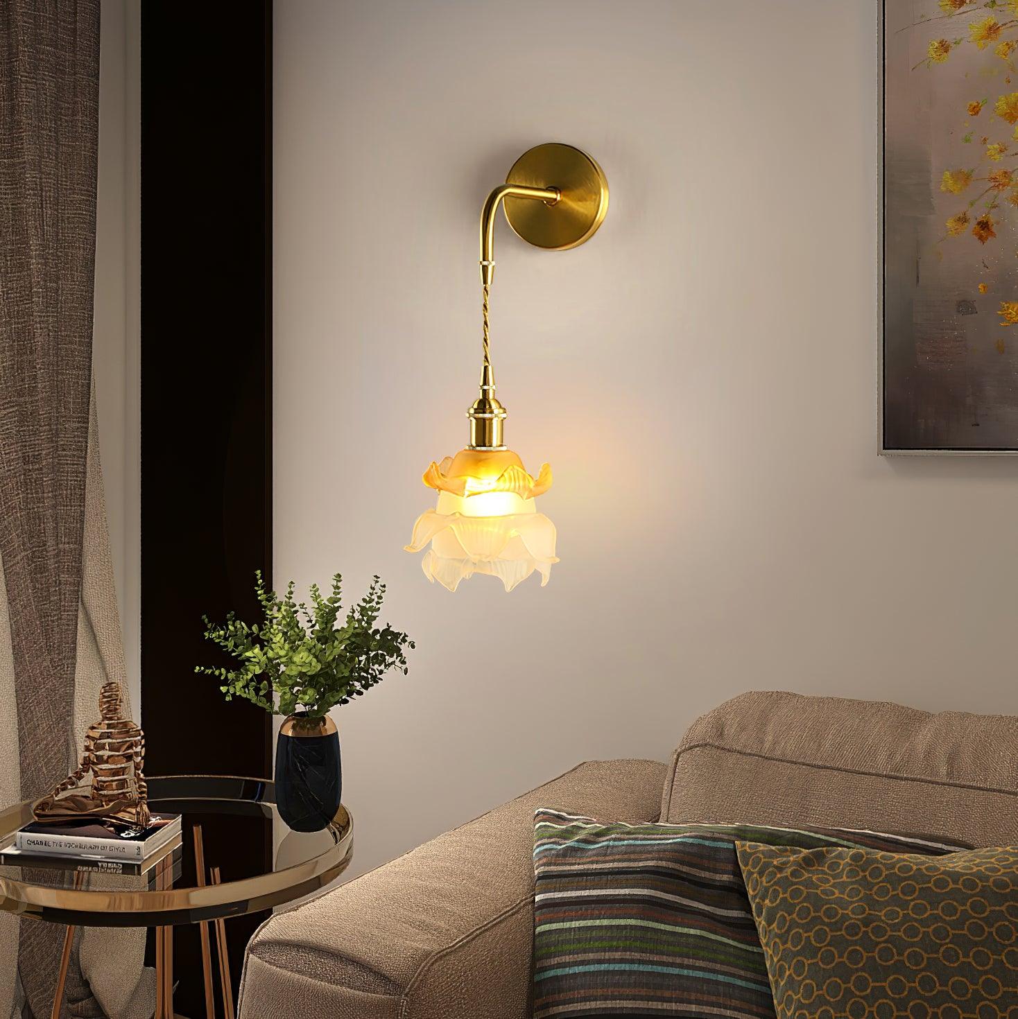 Laura floral wall lamp beside a sofa and side table