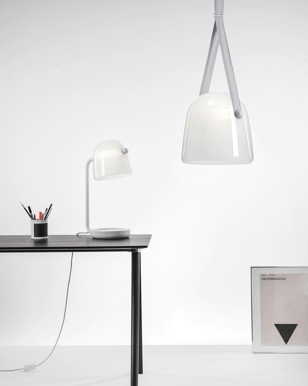 Mona table lamp on a desk with a separate matching pendant above