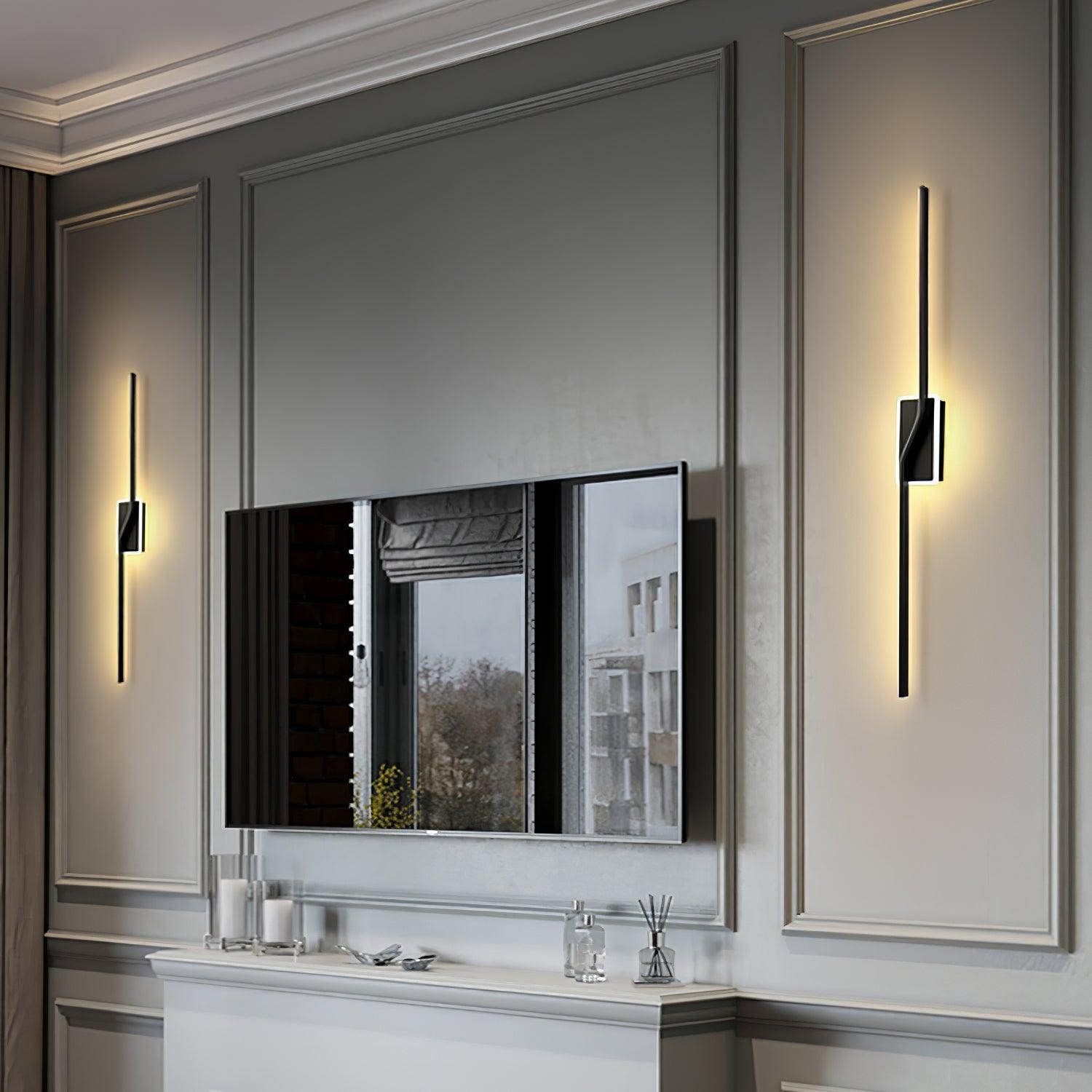 Black vertical strip lights on either side of a dark panel above a fireplace
