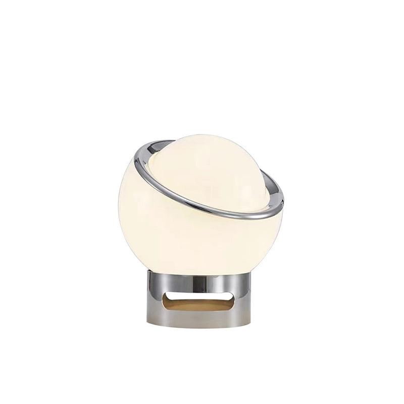 White Valeria lamp with a slanted chrome rim and short cylindrical base