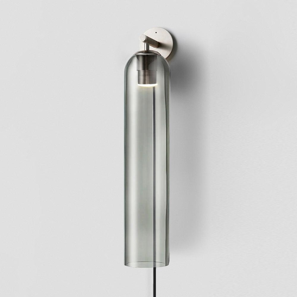 Smoke grey glass cylinder on a sand nickel wall light