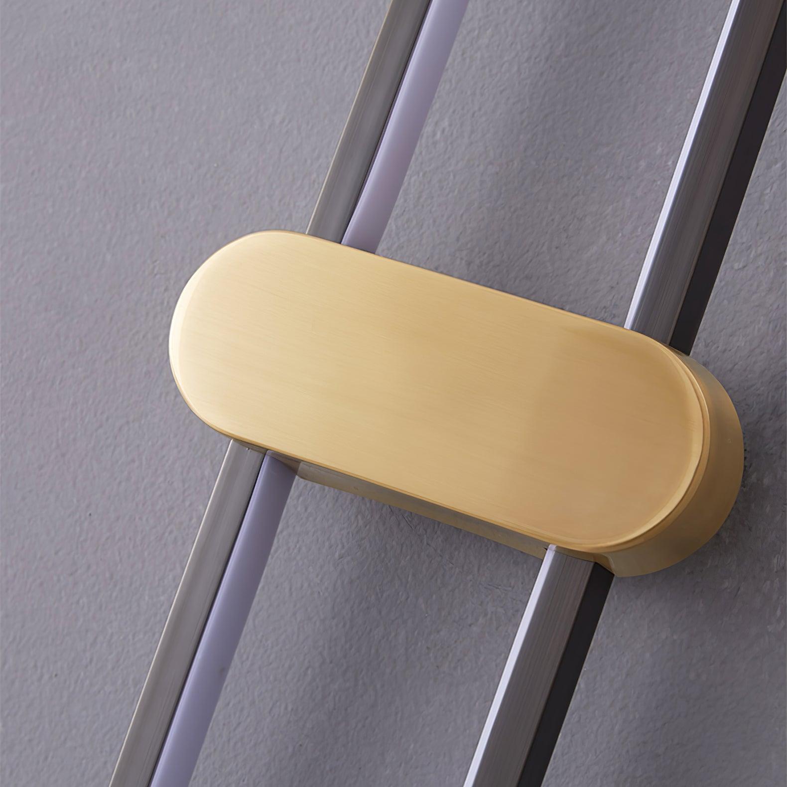 Close-up of the brushed gold-coloured horizontal cover across the black oval loop