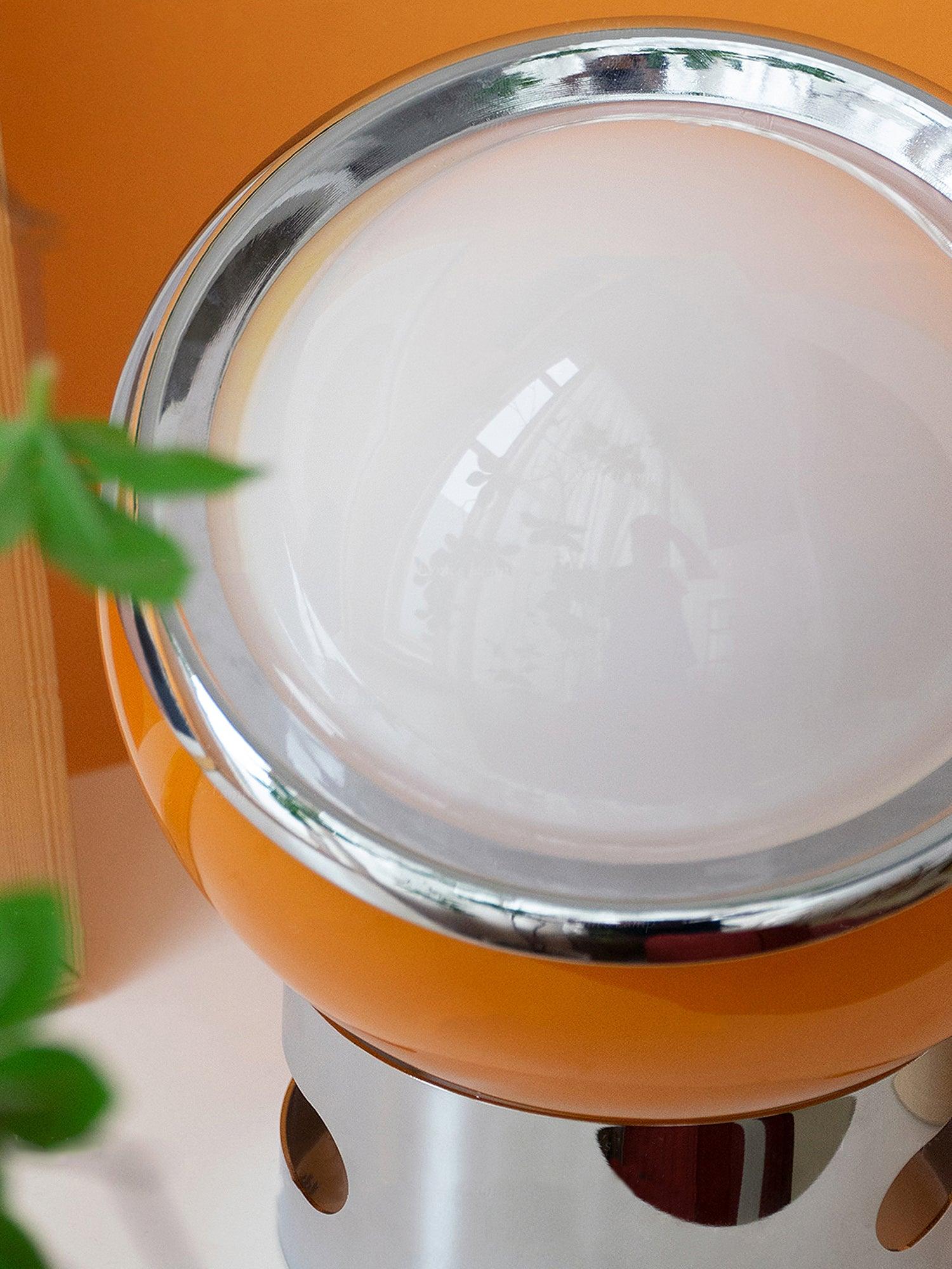 Close-up of Valeria pale glass dome and reflective rim