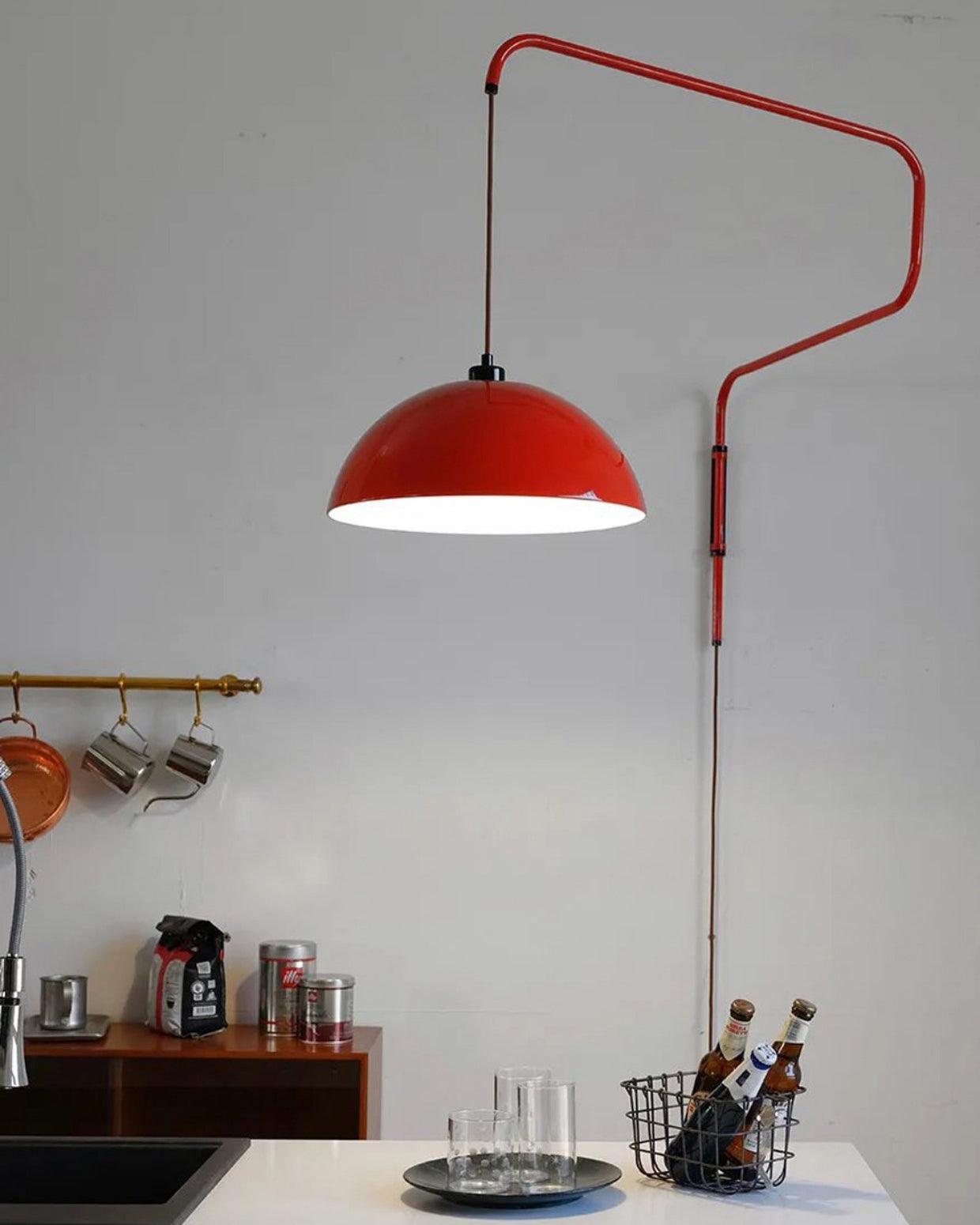 Red suspended shade over a kitchen counter